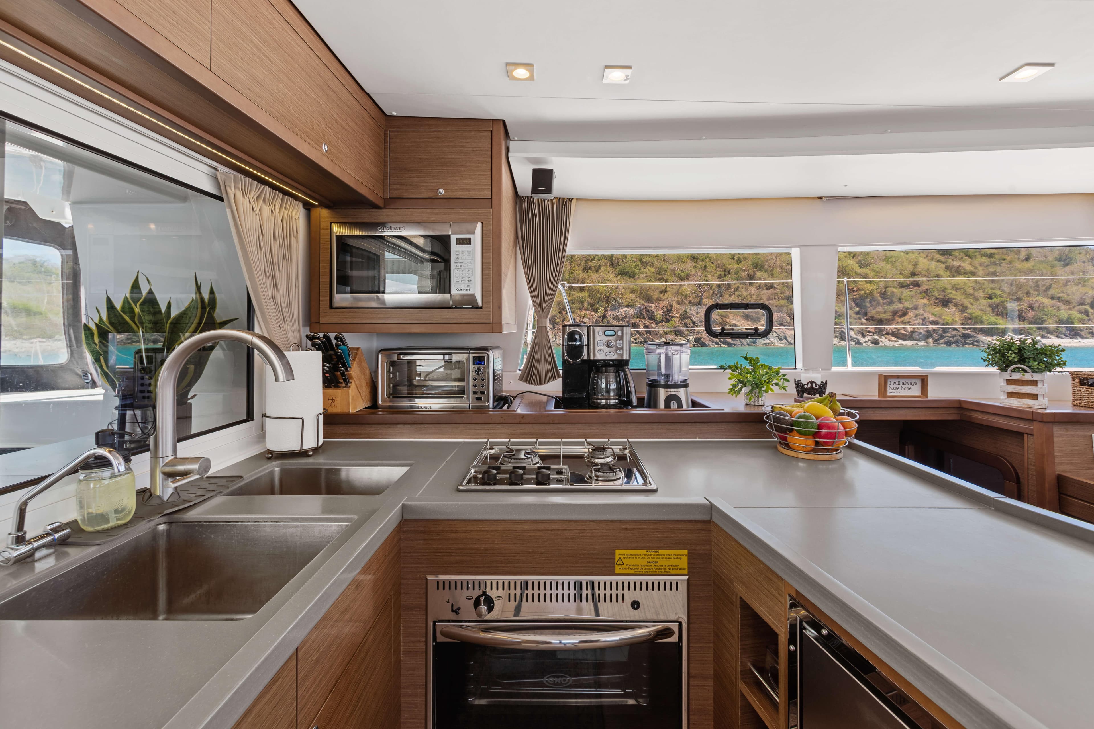 Modern kitchen interior on 2017 Lagoon 450 F yacht with ocean view.