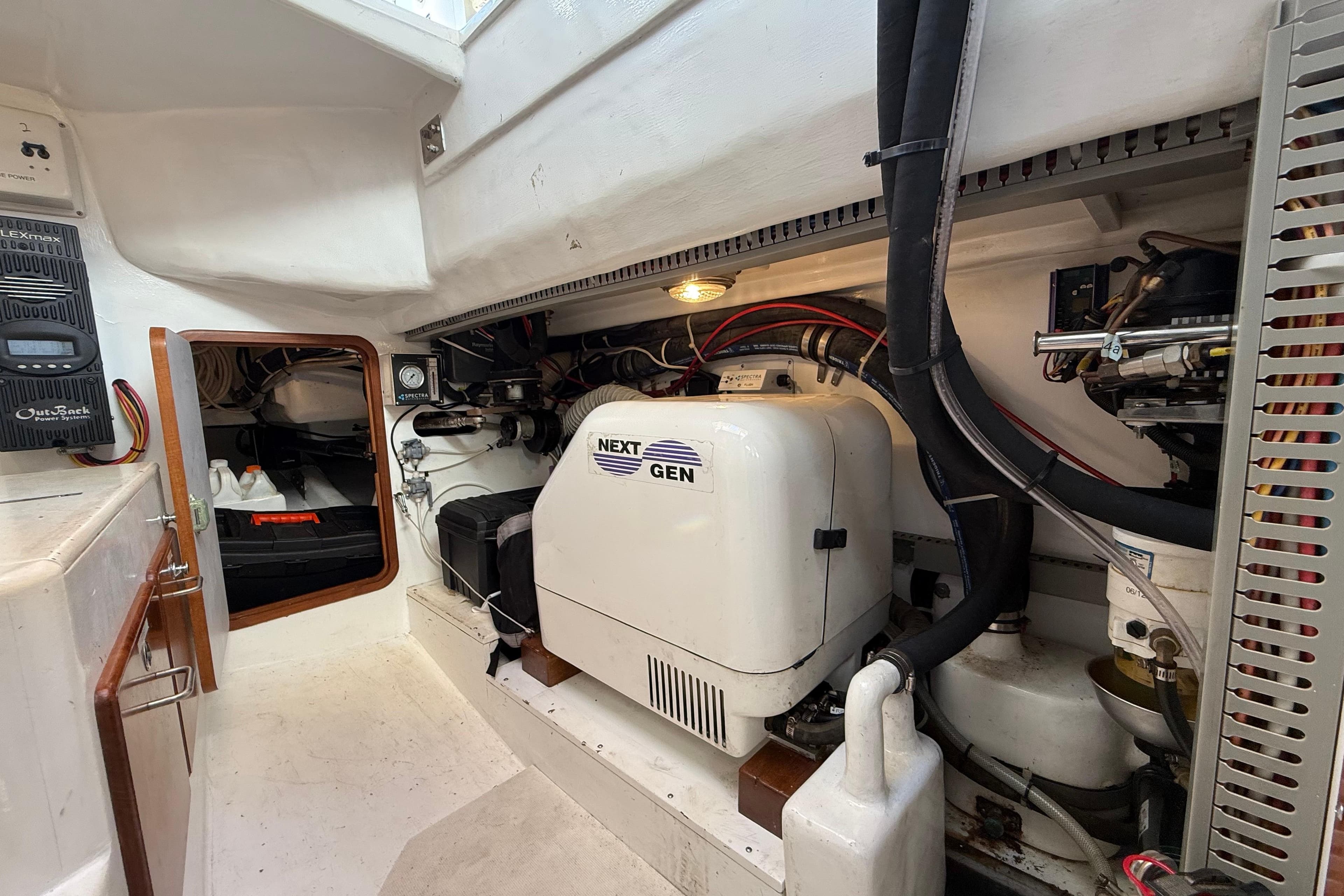 Engine room of 2012 Outbound 46 yacht with Next Gen generator and equipment.