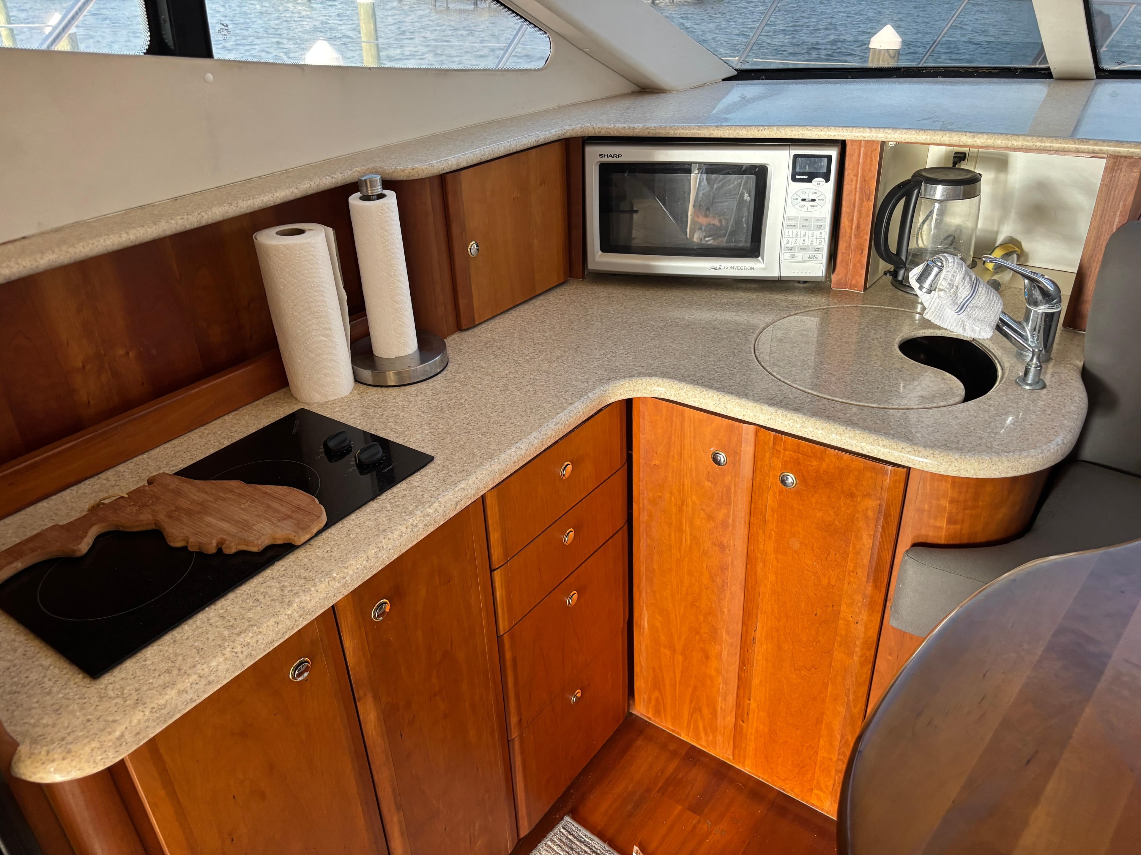 2001 Silverton 410 Sport Bridge kitchen with microwave, stove, and sink.