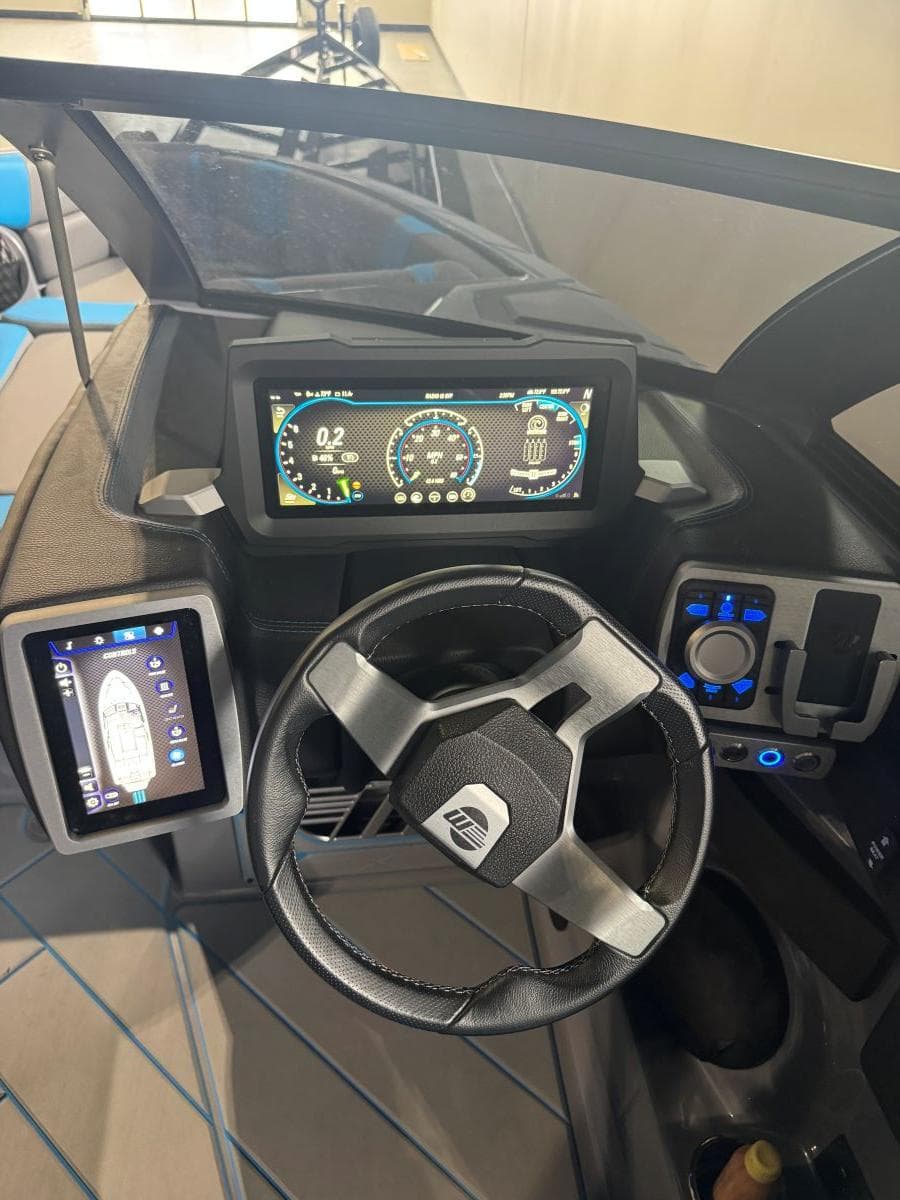 2022 Malibu Wakesetter 25 LSV dashboard with digital displays and steering wheel.