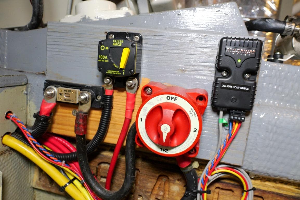 Electrical panel of 1981 Tollycraft 48 Cockpit Motor Yacht with switches and wiring.