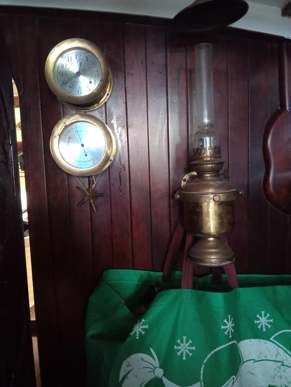 Vintage nautical interior with brass instruments and lamp on Formosa 41, 1973.