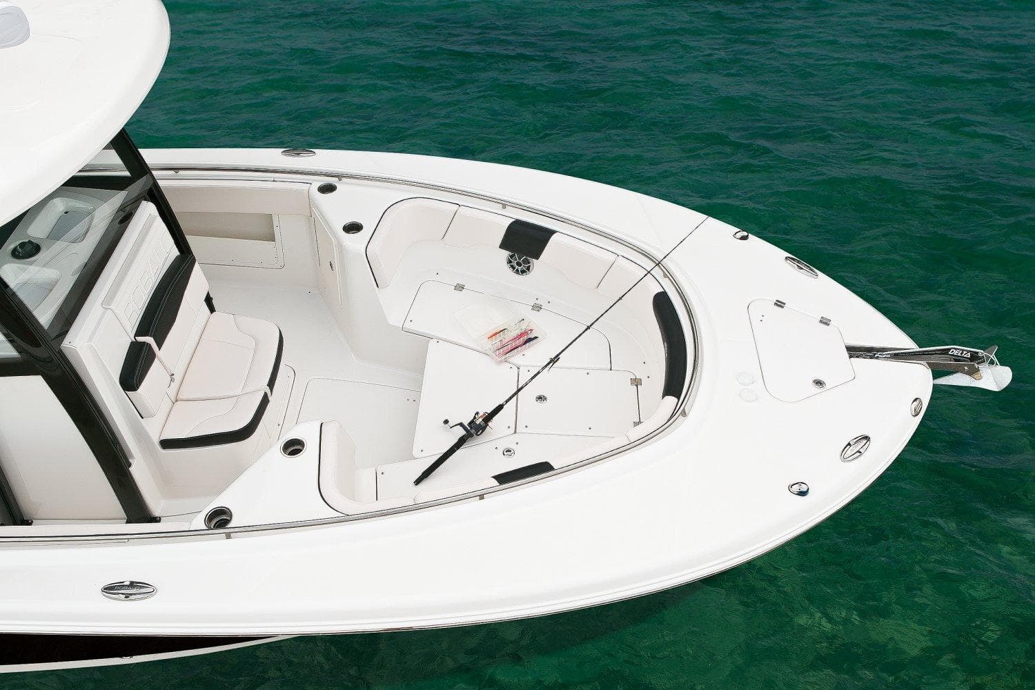 Manufacturer Provided Image: 2017 Robalo R302 Center Console boat on clear water.