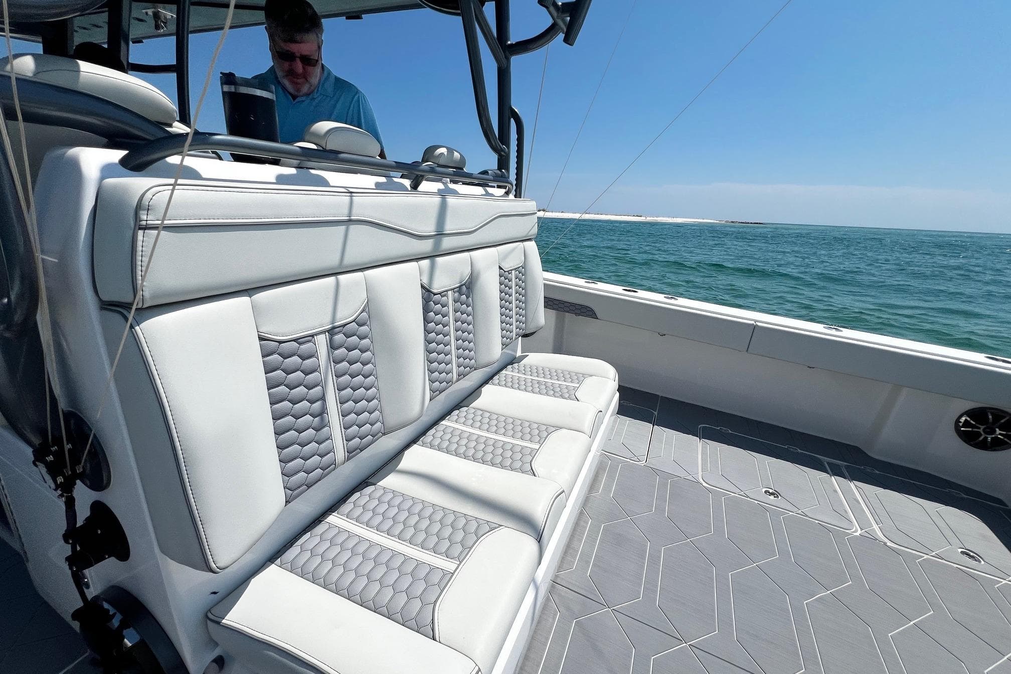 2022 Invincible 46 Catamaran with luxurious seating, cruising on open water.