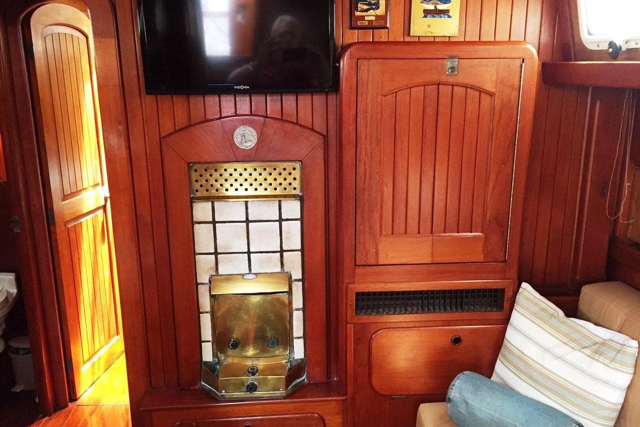Interior of 1983 Stuart Marine 62 Custom Ketch with wood paneling and brass accents.
