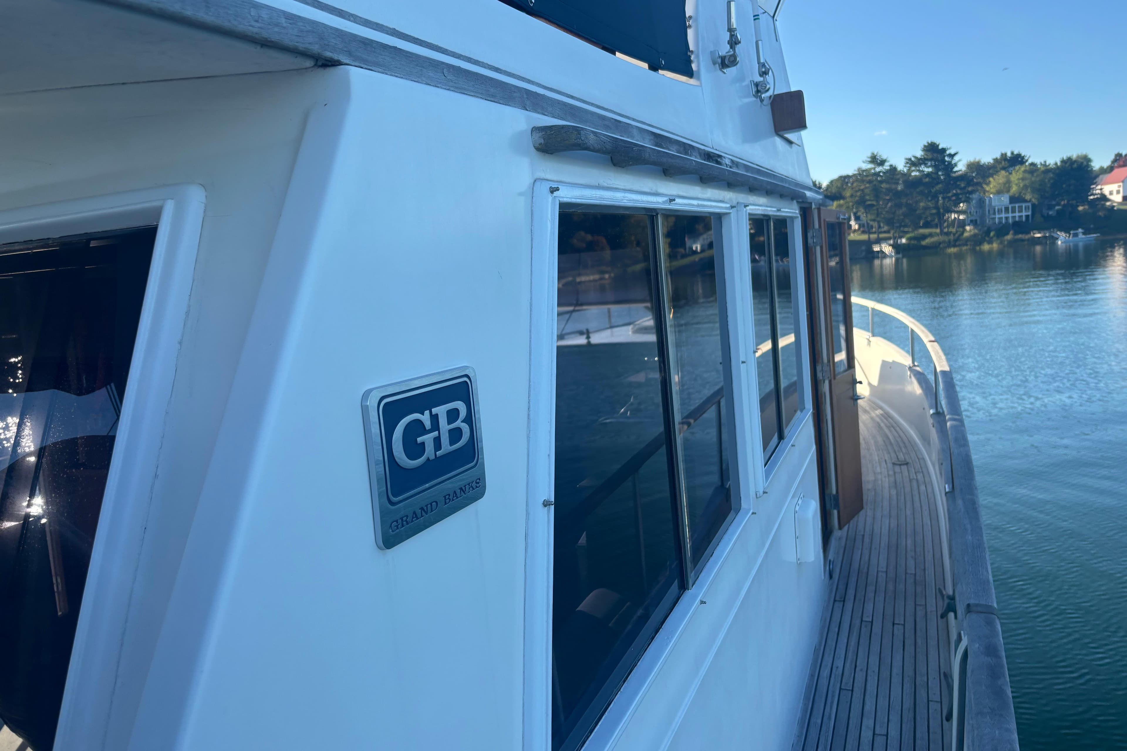 1989 Grand Banks 46 Classic yacht on serene water, showcasing elegant design and craftsmanship.