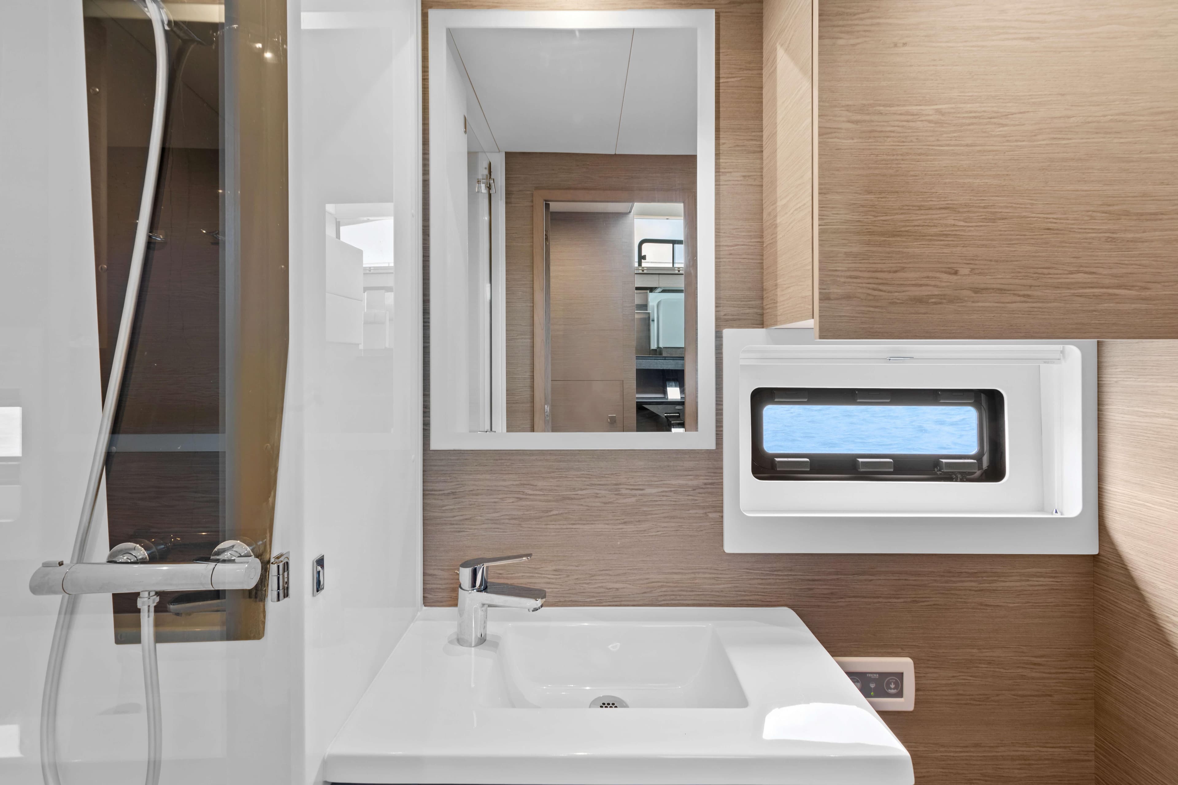 Modern bathroom interior of 2024 Fountaine Pajot MY6 yacht with sleek fixtures.
