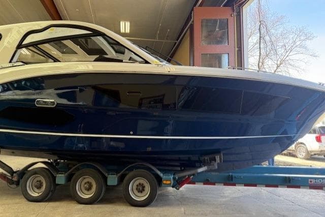 2026 Sea Ray Sundancer 370 on trailer in a garage setting.