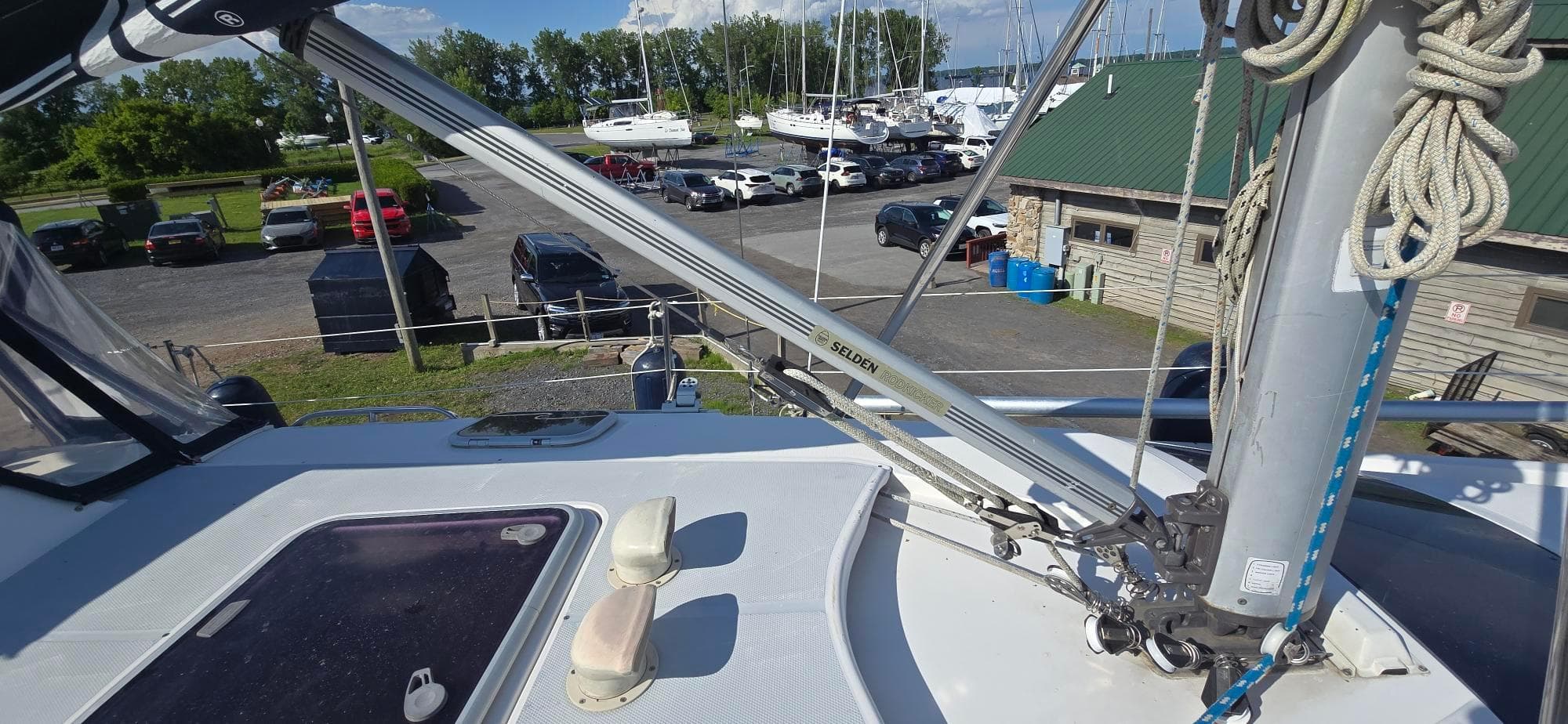 Deck view of a 2000 Hunter 340 sailboat in a marina setting.