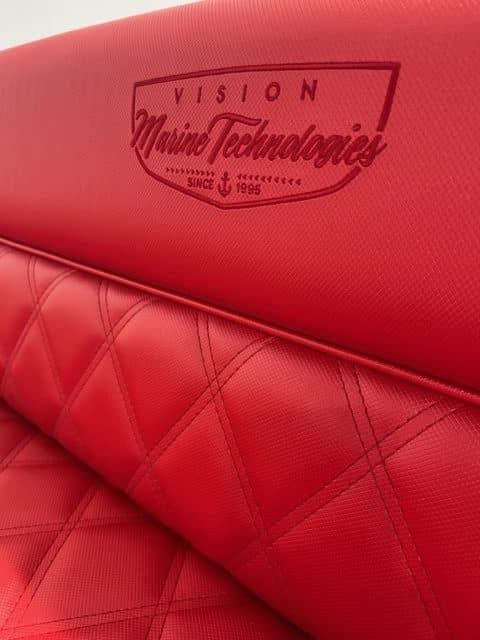 Red quilted seat with Vision Marine Technologies logo, Fantail 217, 2023 model.
