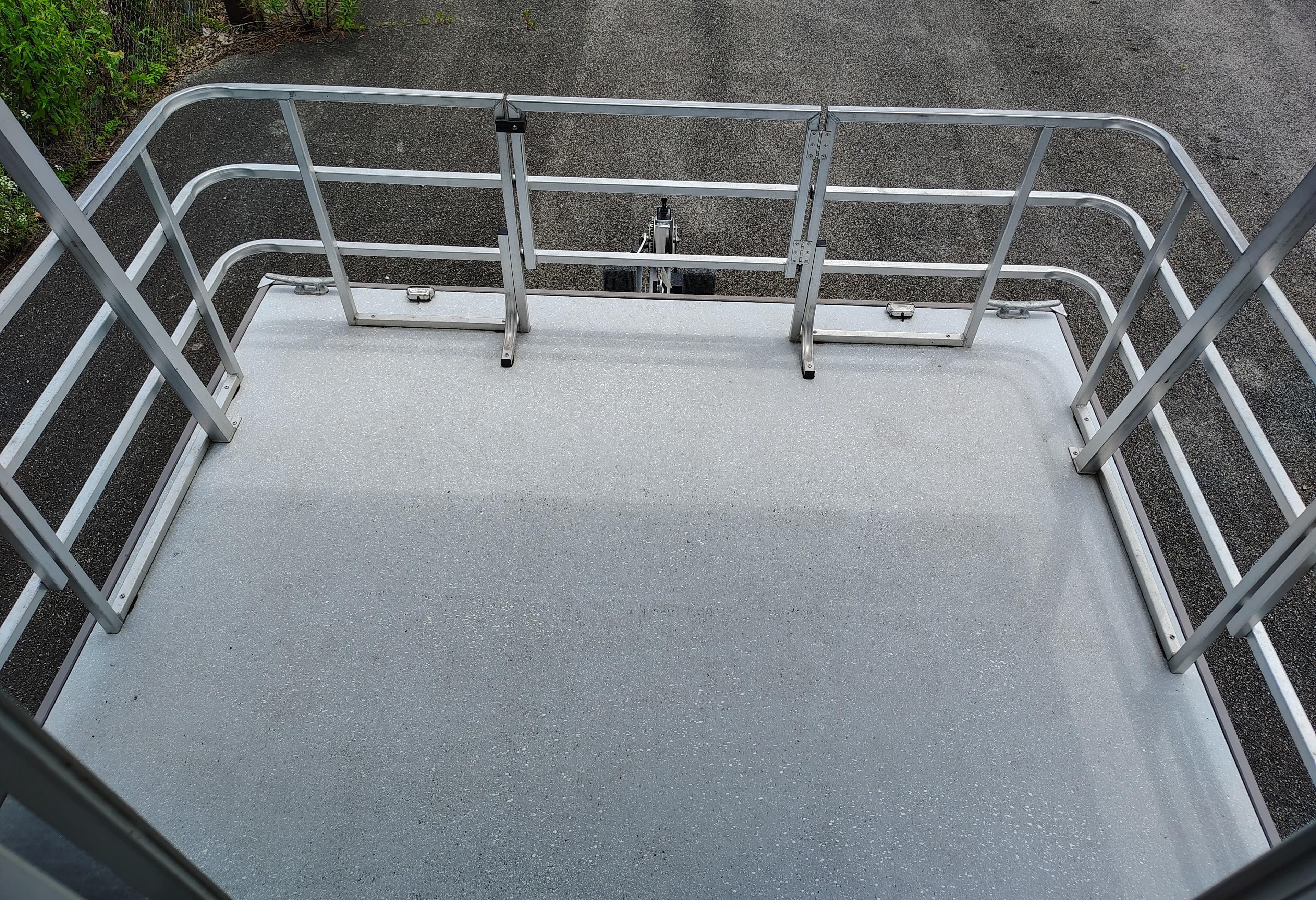 2017 Catamaran Cruisers Lil Hobo 31 deck with metal railings.