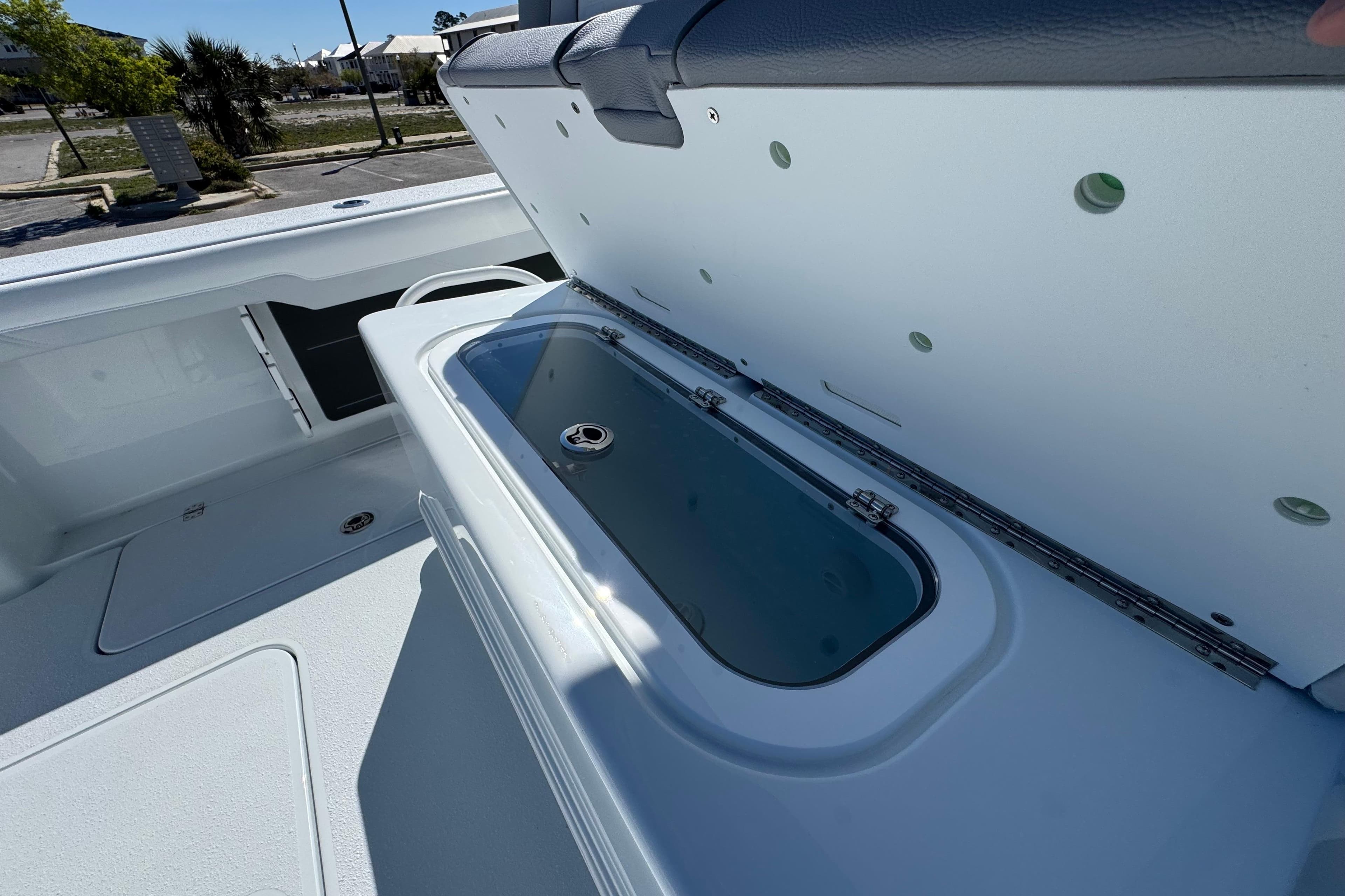 2026 Yellowfin 36 Offshore boat with open storage compartment on deck.