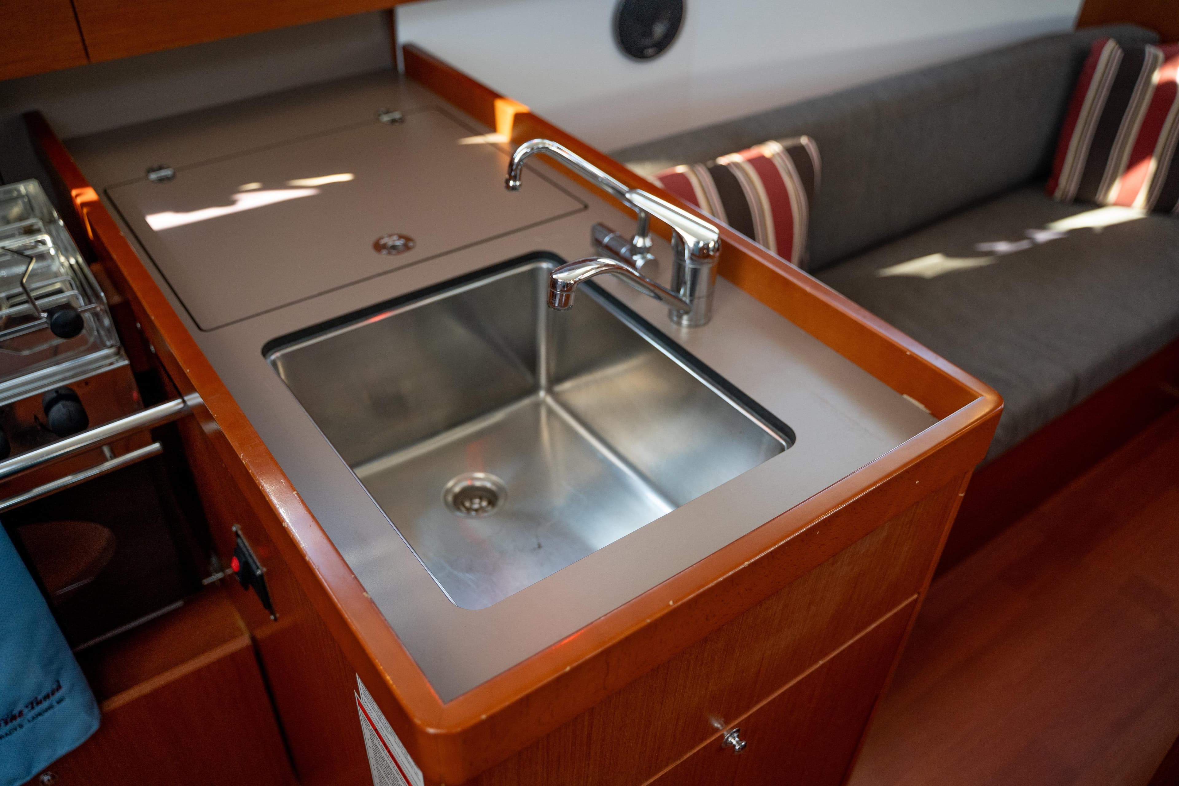 Modern kitchen sink in 2018 Beneteau Oceanis 38.1 yacht interior.