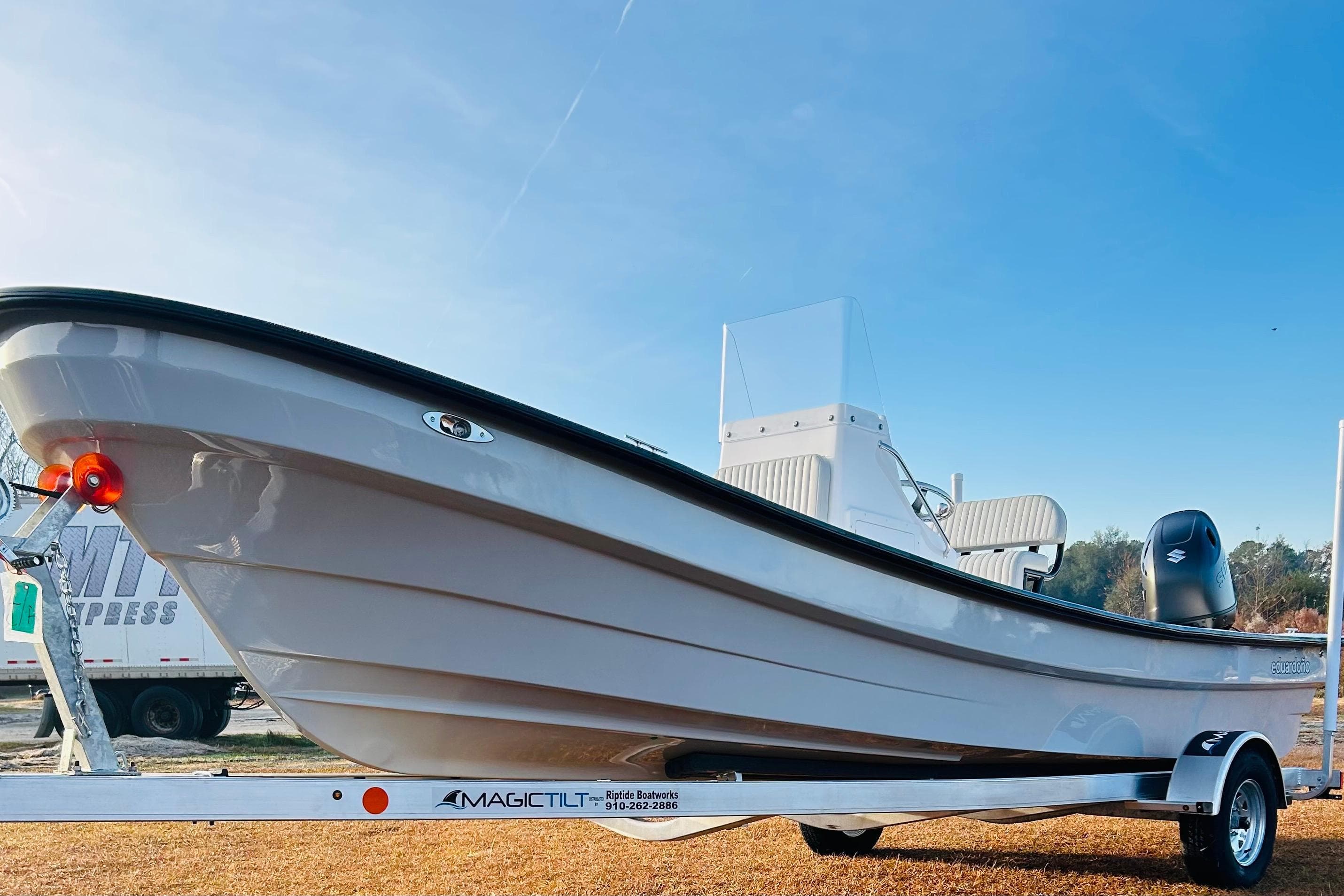2025 Panga Eduardono Panga 22 boat on trailer, clear sky background.
