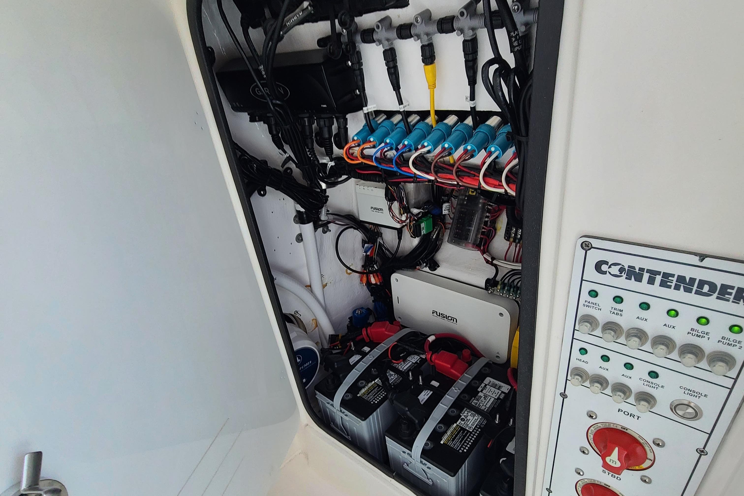 2023 Contender 25 Tournament boat electrical panel and battery compartment.
