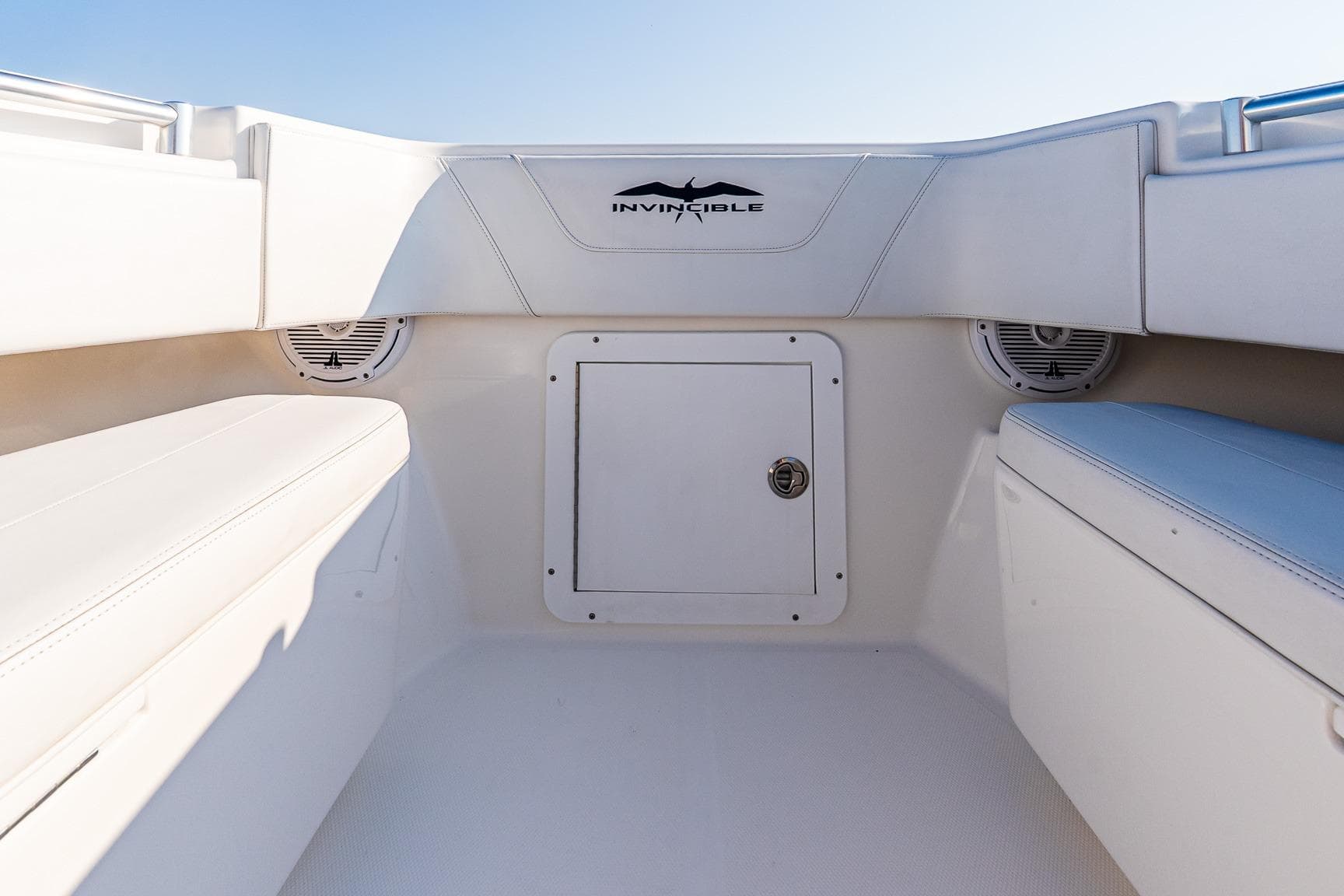 2016 Invincible 33 Open Fisherman boat interior with storage compartment and seating.