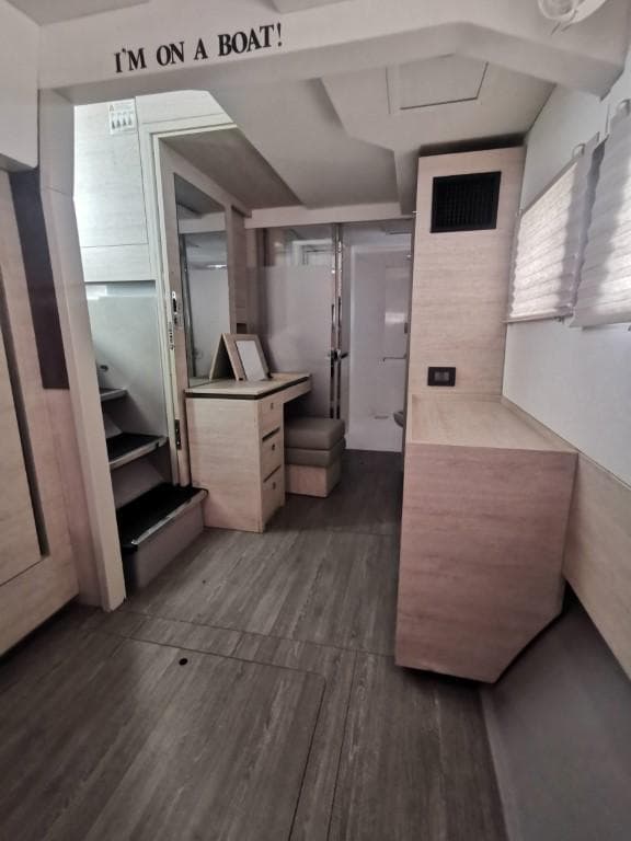 Modern interior of a 2019 Leopard 50 yacht with light wood finishes.