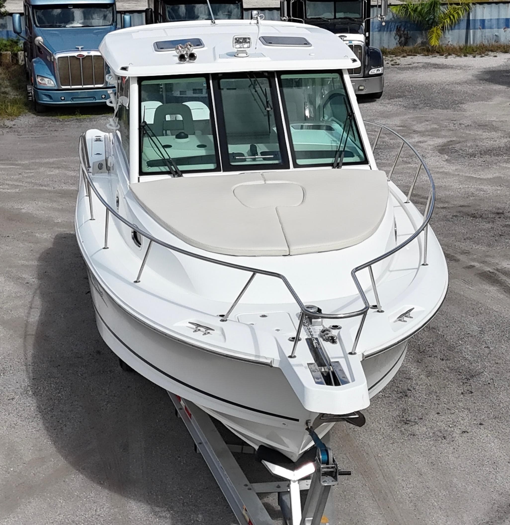 2019 Boston Whaler 345 Conquest boat on trailer, parked outdoors.