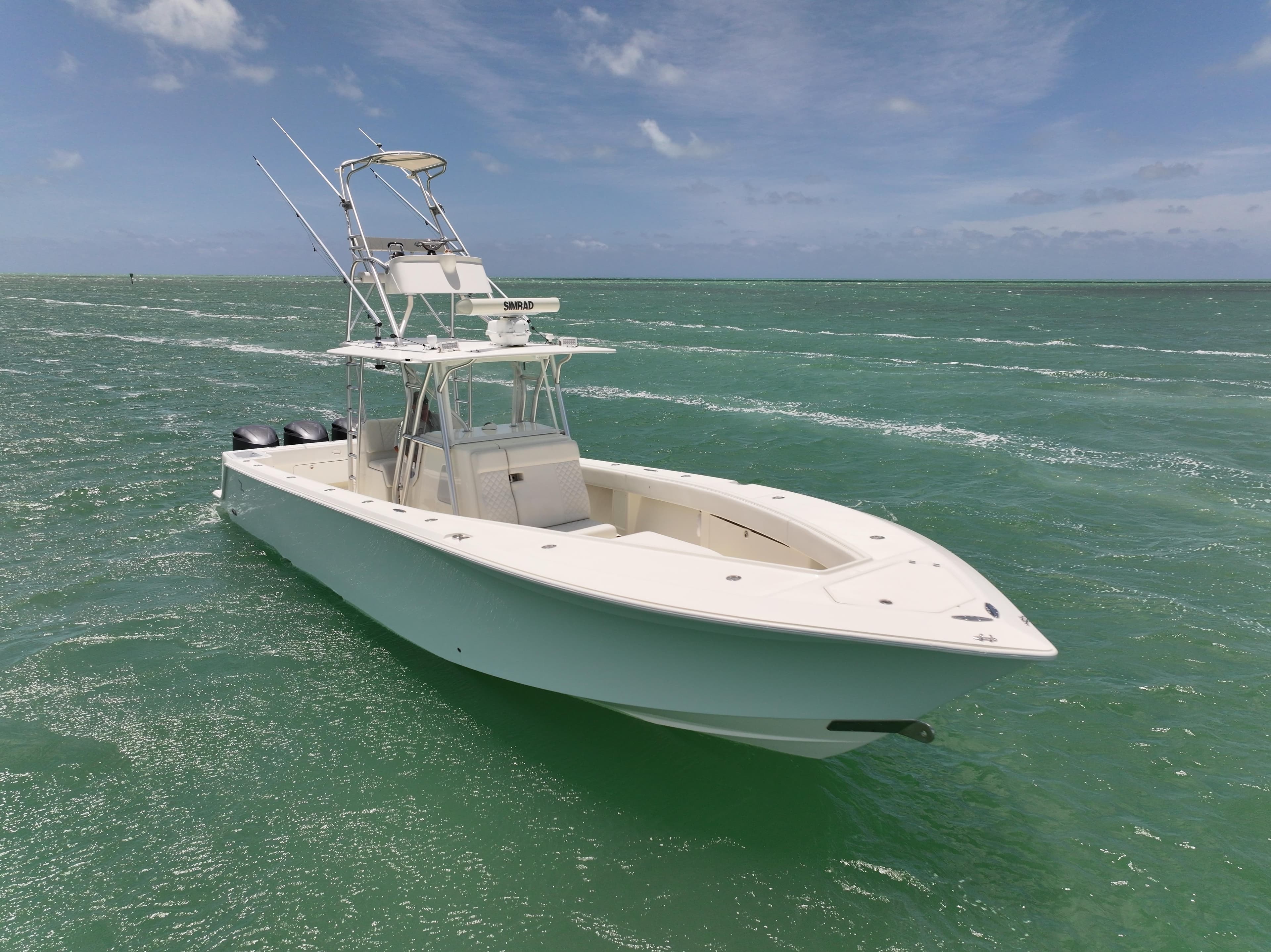 2015 SeaVee 370z boat on clear ocean water under a blue sky.