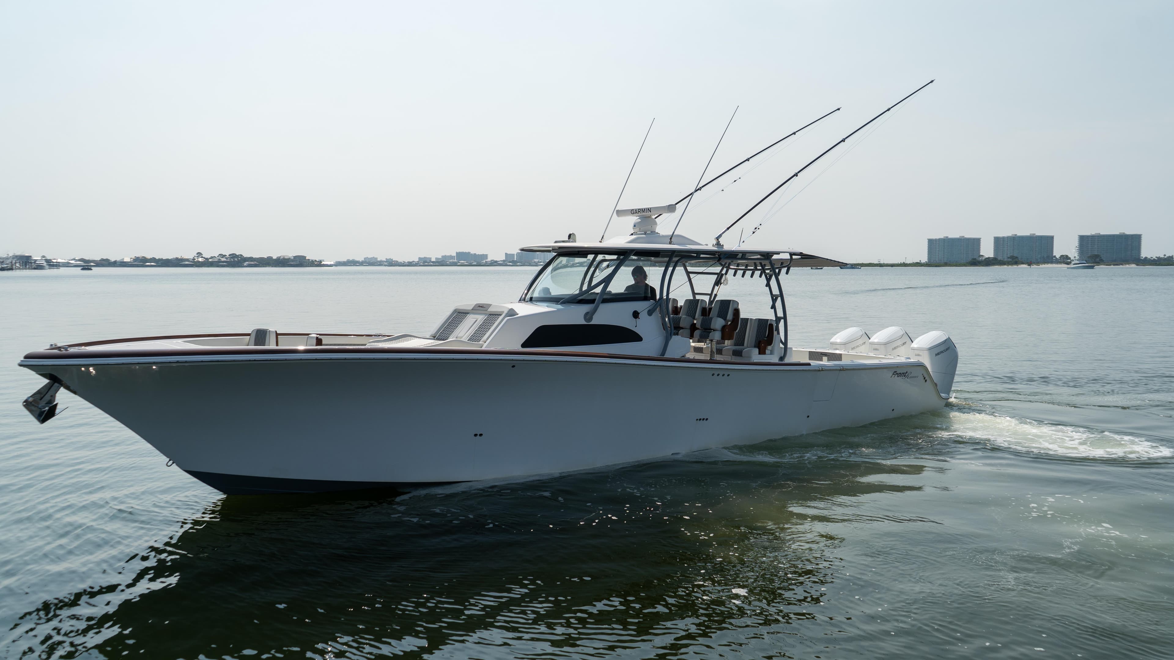 2023 Front Runner 47 Center Console boat cruising on calm water.