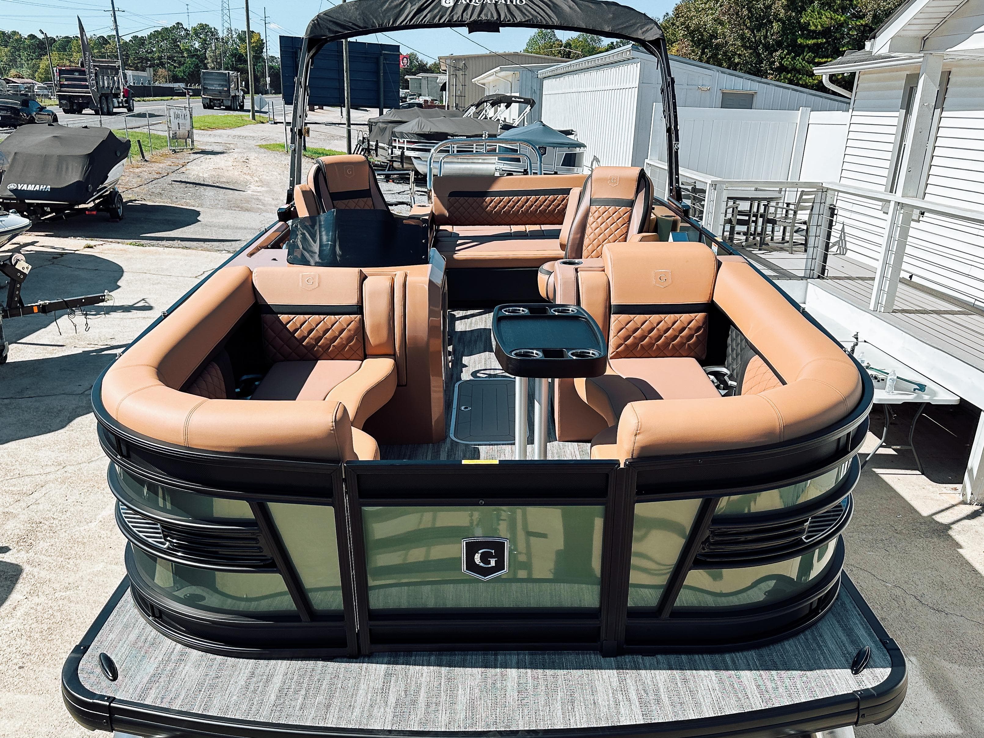2025 Godfrey AquaPatio 23' Flip Lounge Tritoon with luxurious seating and modern design.