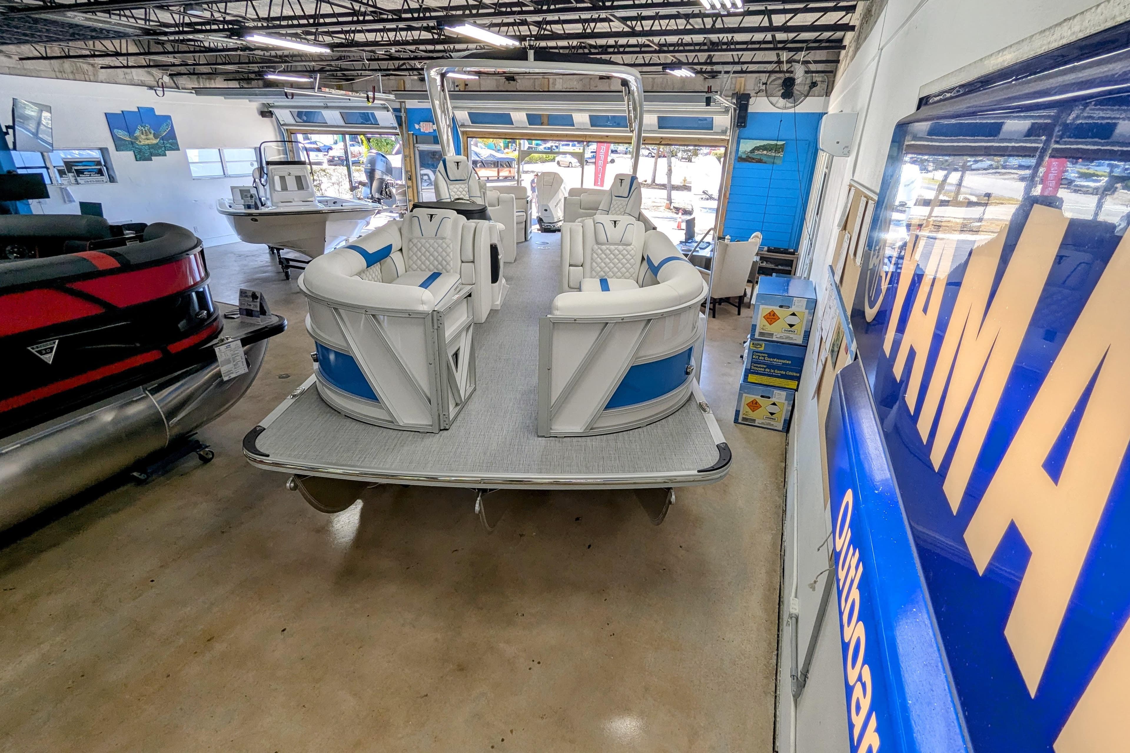 2026 Trifecta 25 RF SS Arch pontoon boat displayed in a showroom.