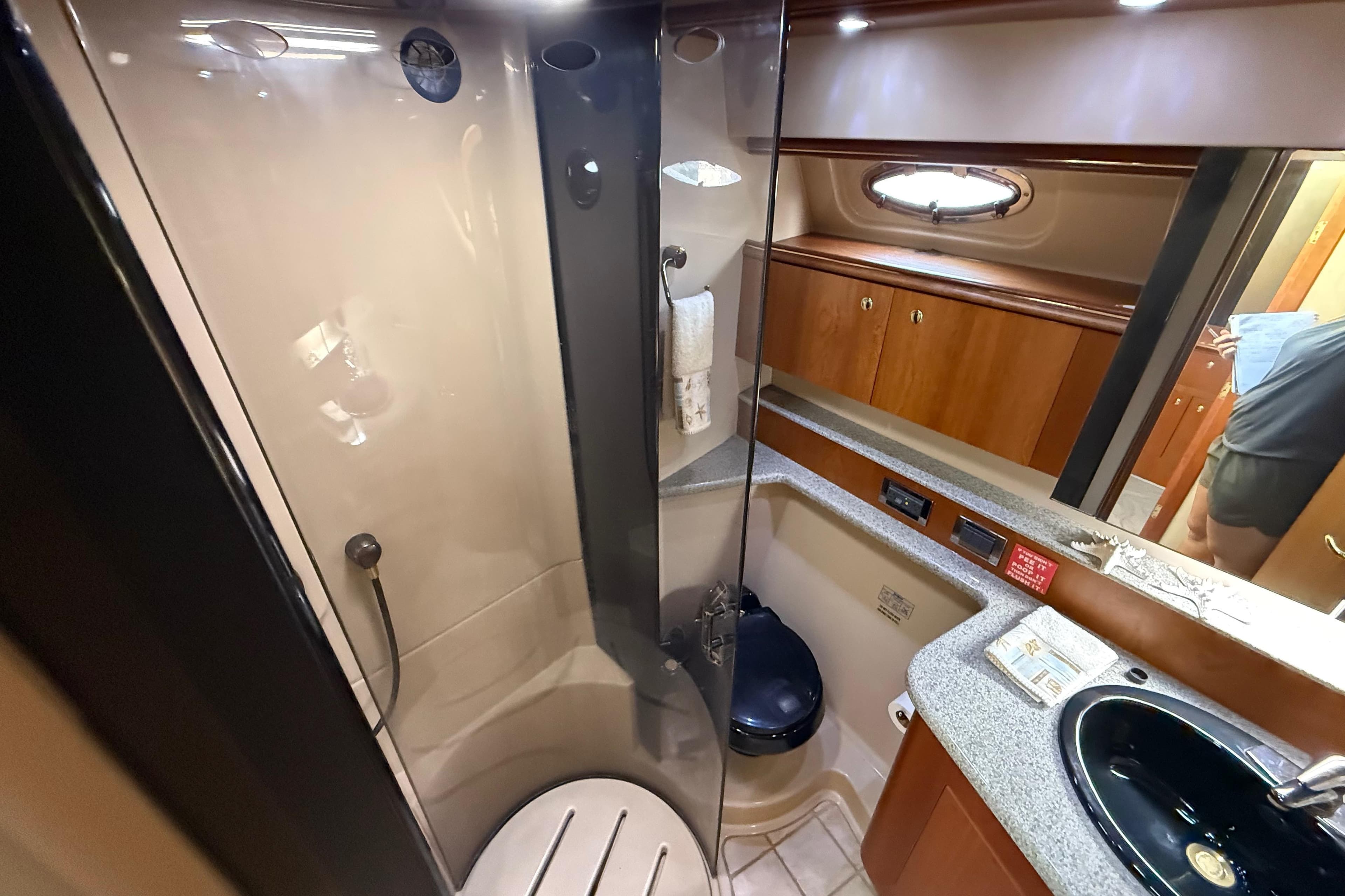 Luxurious bathroom in 2002 Cruisers Yachts 4450 Express Motoryacht with modern amenities.