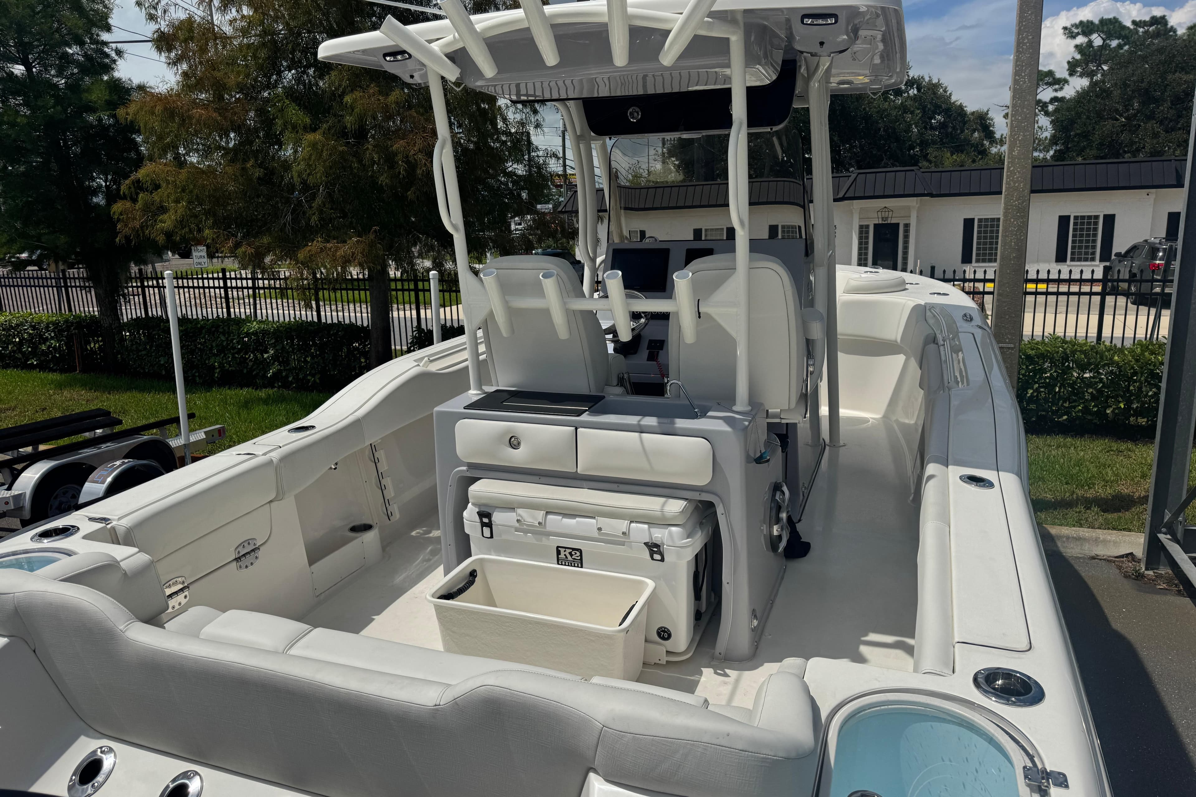 2025 Key West 263 FS boat interior with seating, console, and storage compartments.