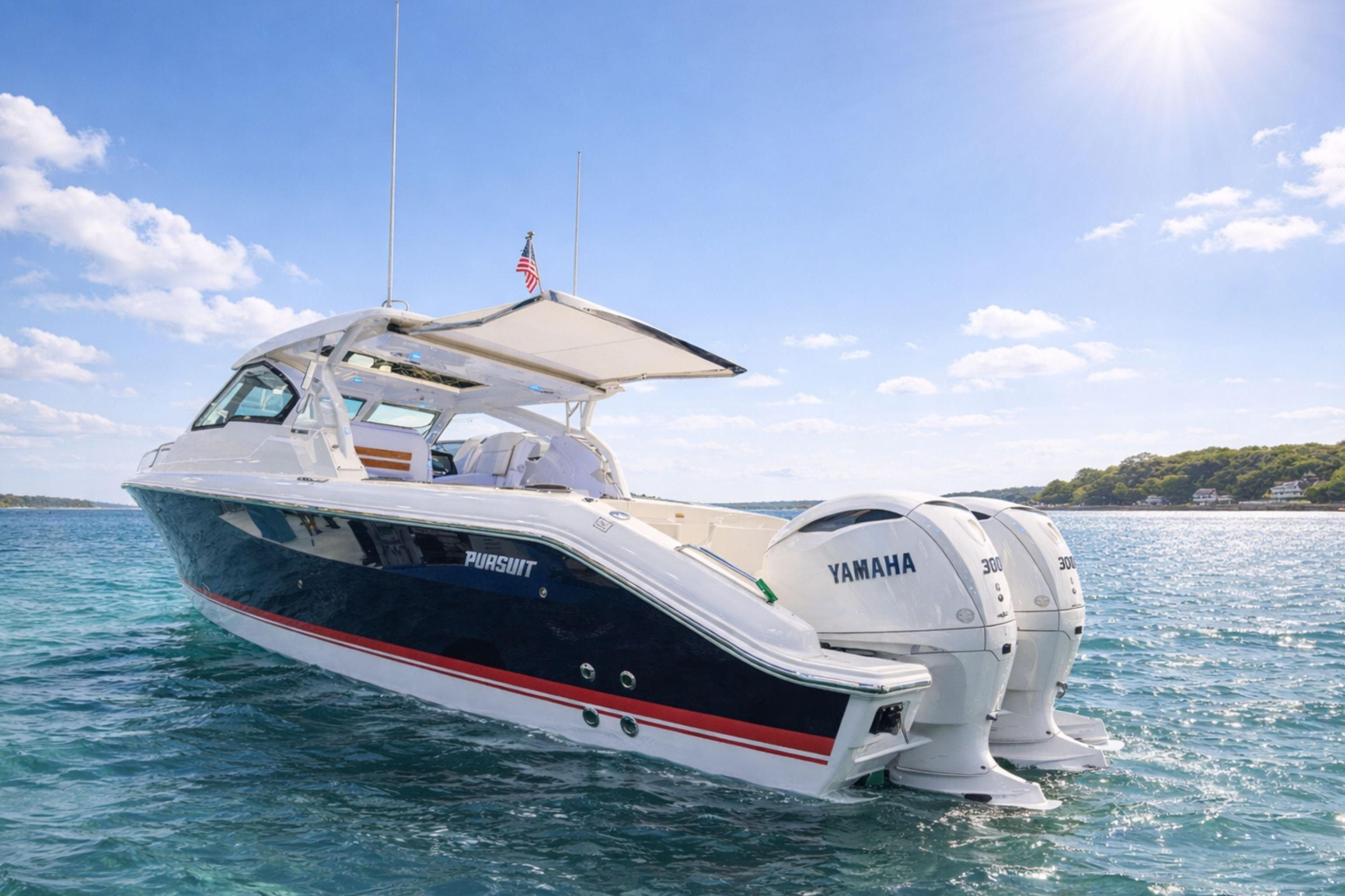 2026 Pursuit DC 365 Dual Console boat on clear blue water, sunny day.