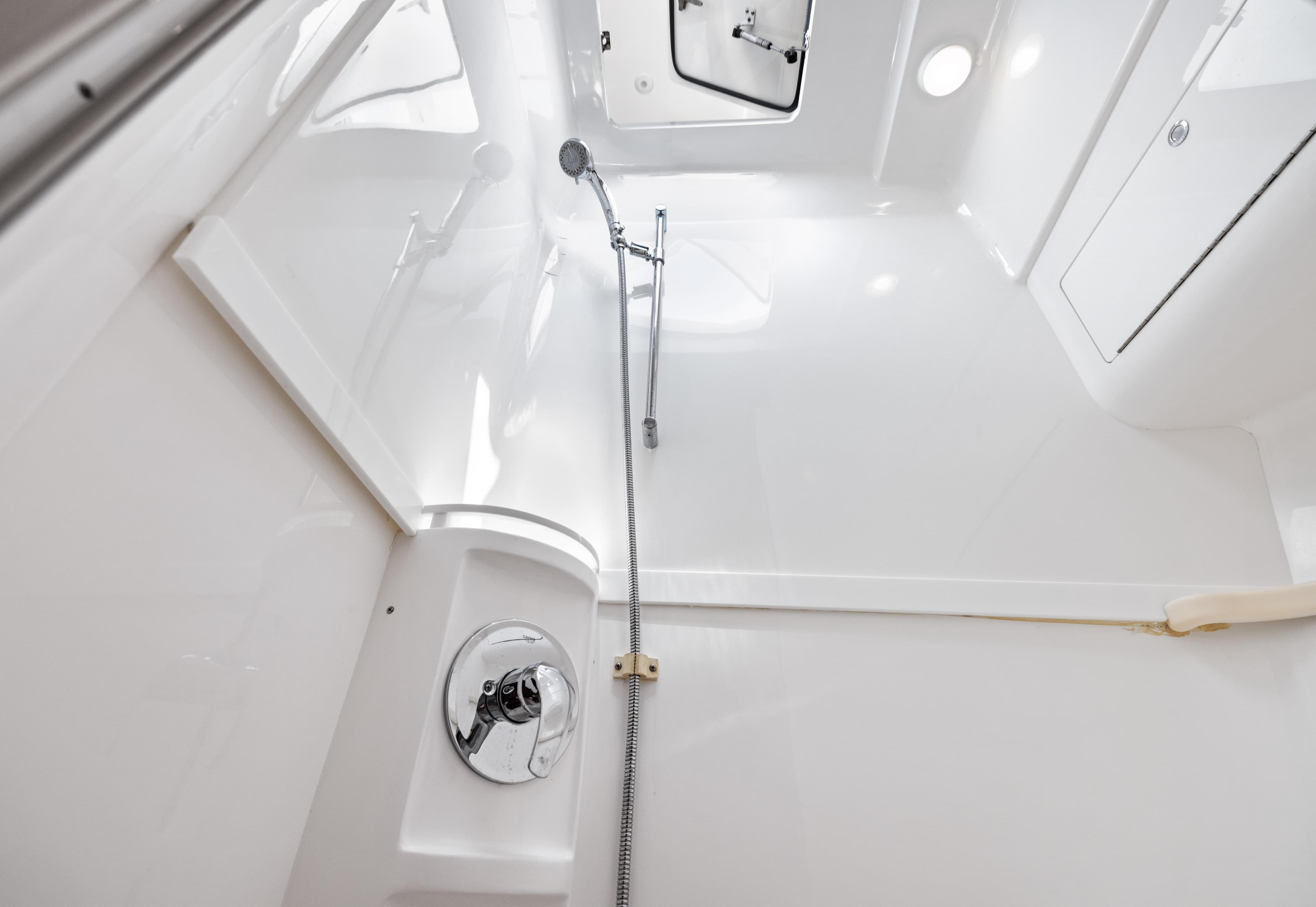 2015 Intrepid 430 Sport Yacht shower area with sleek, modern design and chrome fixtures.