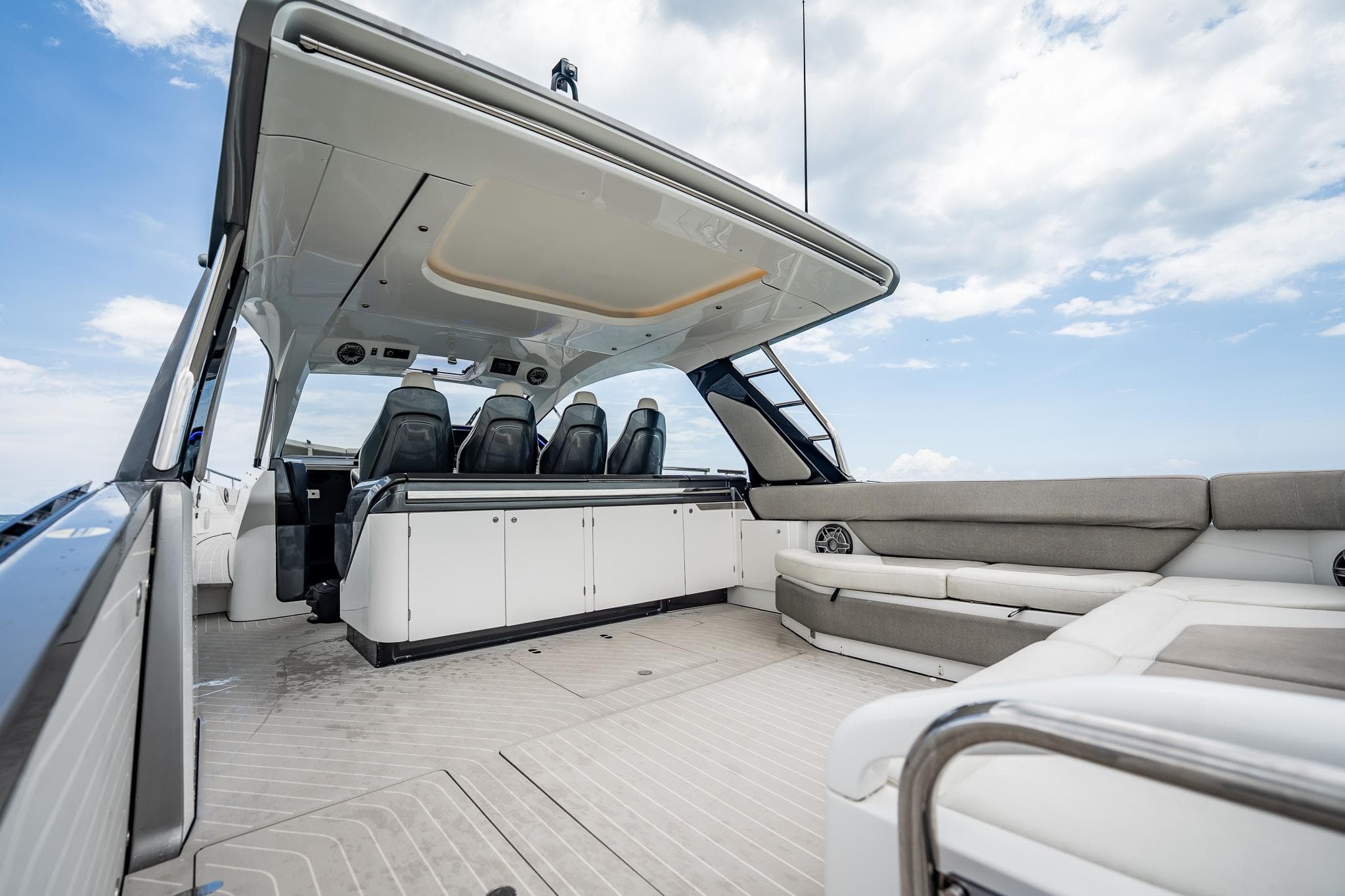 2021 Azimut Verve 47 yacht interior with sleek seating and modern design under a clear sky.