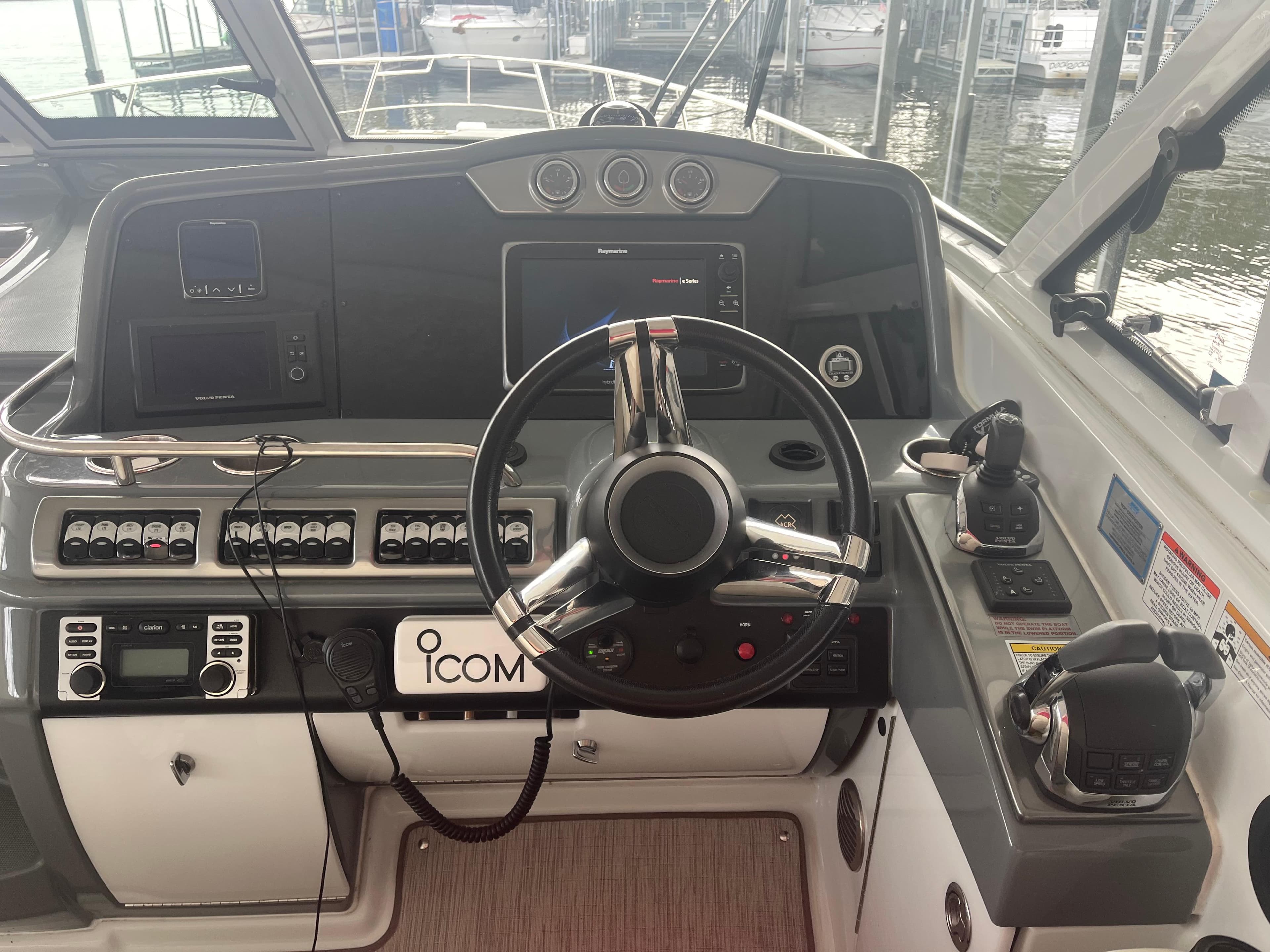 2014 Formula 45 Yacht helm with advanced navigation controls and steering wheel.