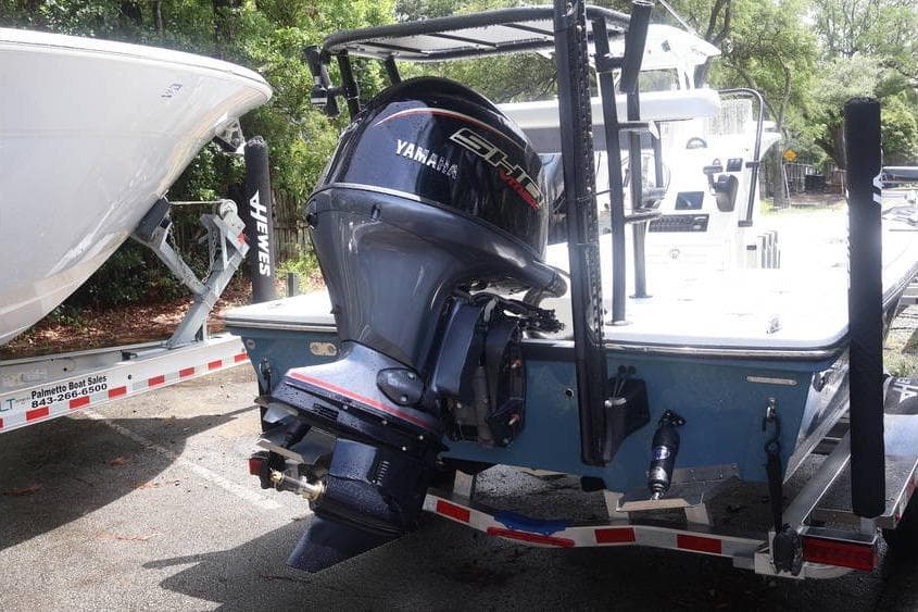 2025 Hewes Redfisher 18 boat with Yamaha outboard motor on trailer.