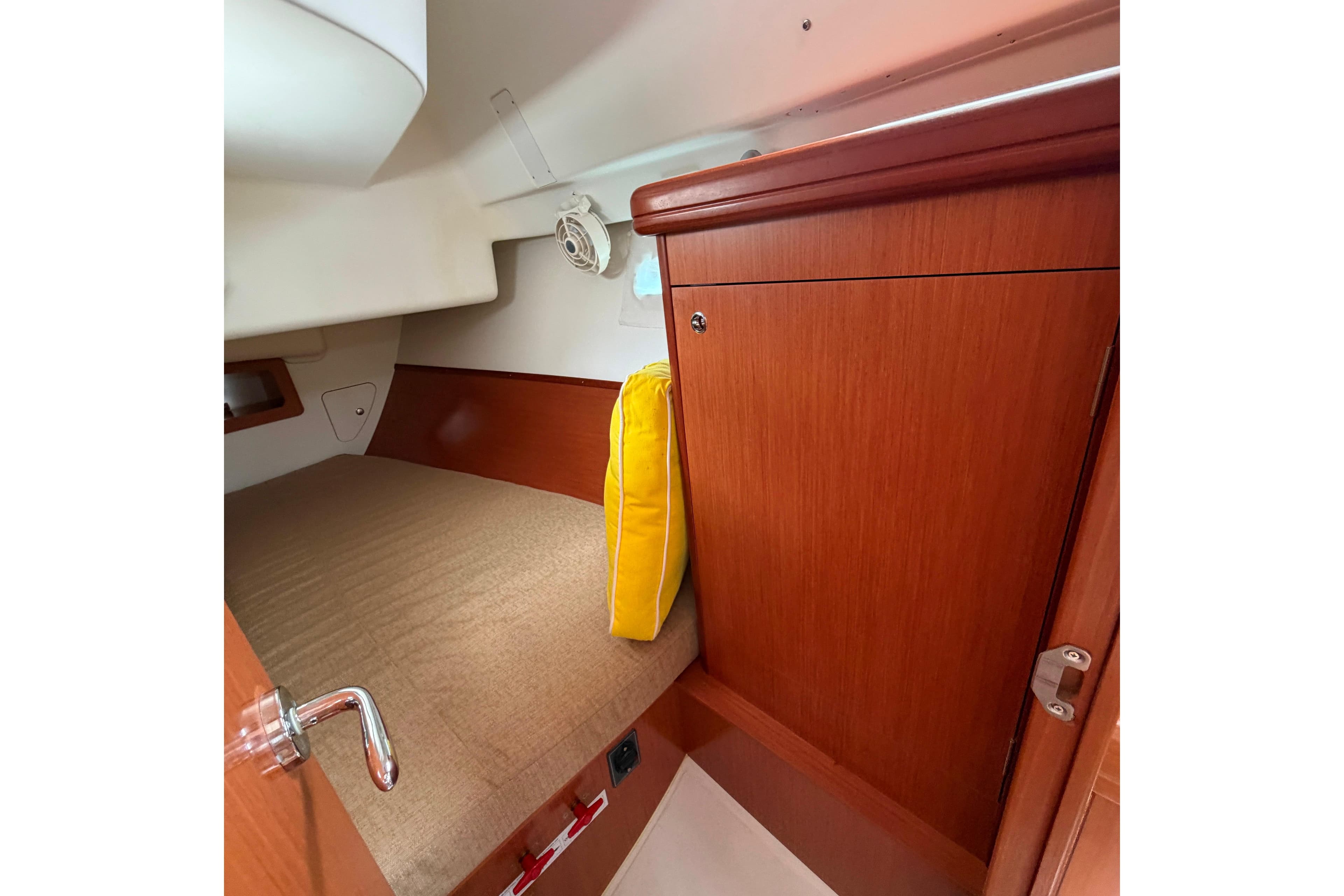 Cozy cabin interior of 2008 Beneteau Oceanis Clipper 343 sailboat with wooden finish.