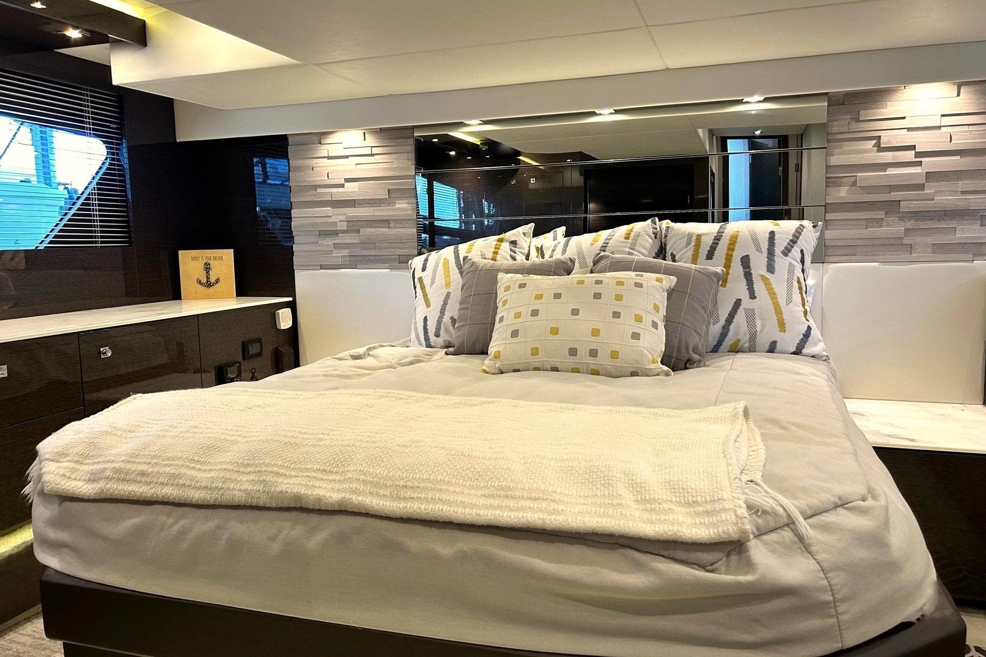 Luxurious bedroom interior of 2021 Cruisers Yachts 50 Cantius with modern decor.