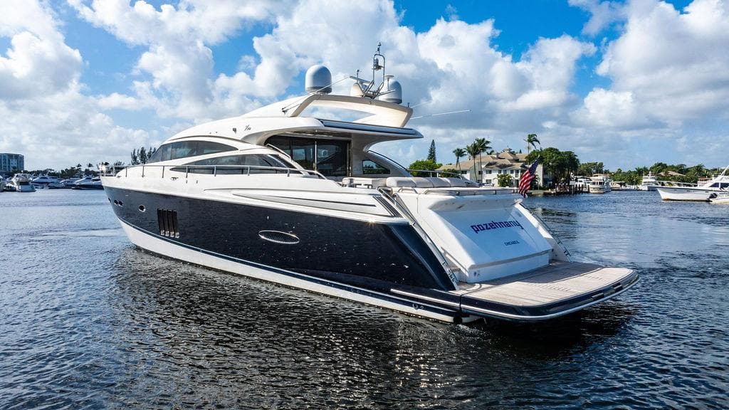 Luxurious 2010 Princess V78 yacht cruising on a sunny day, featuring sleek design and elegance.