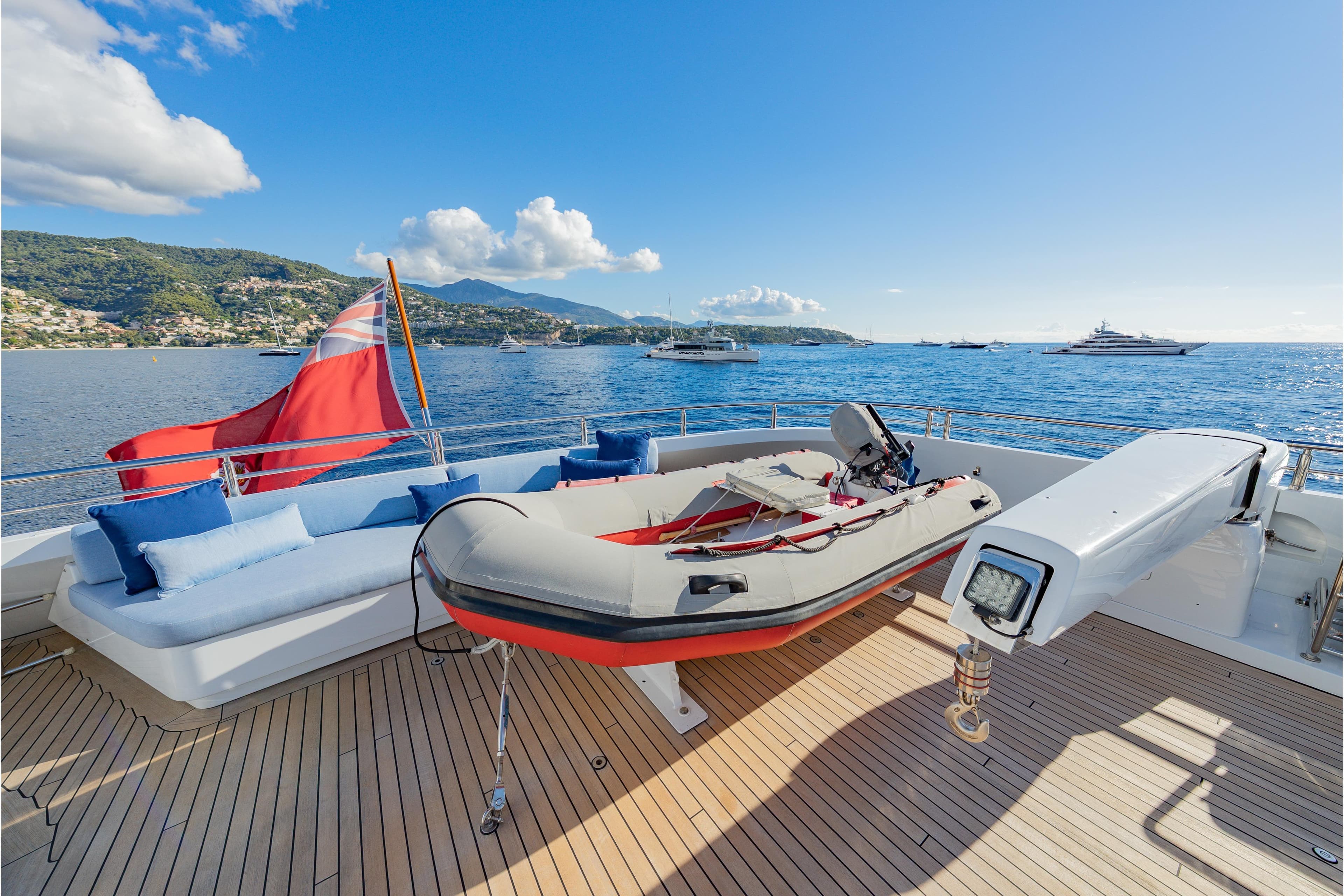 Luxurious 2009 Timmerman Expedition Tri-Deck yacht with tender, scenic ocean view.