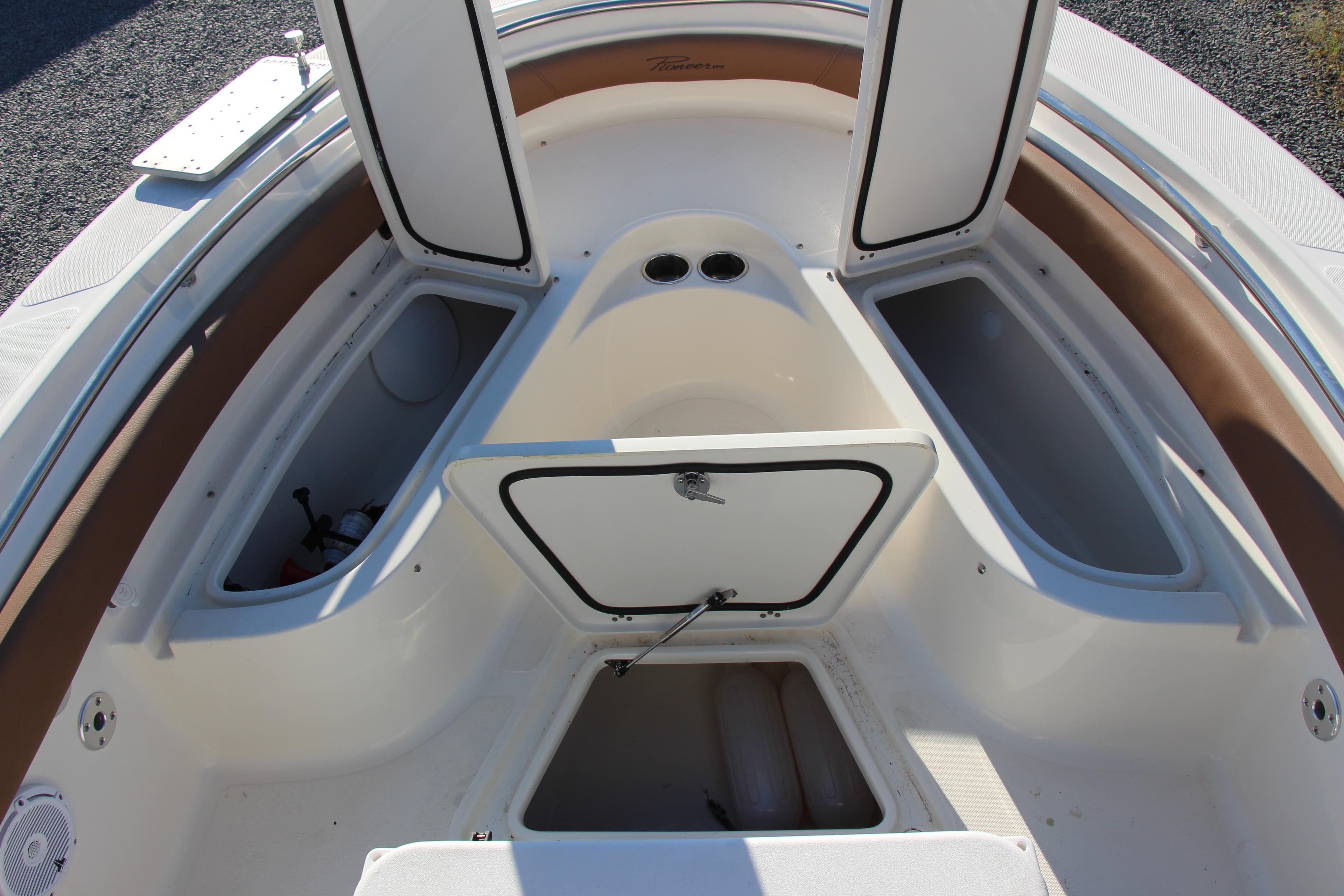 2022 Pioneer 222 Islander boat interior with open storage compartments.