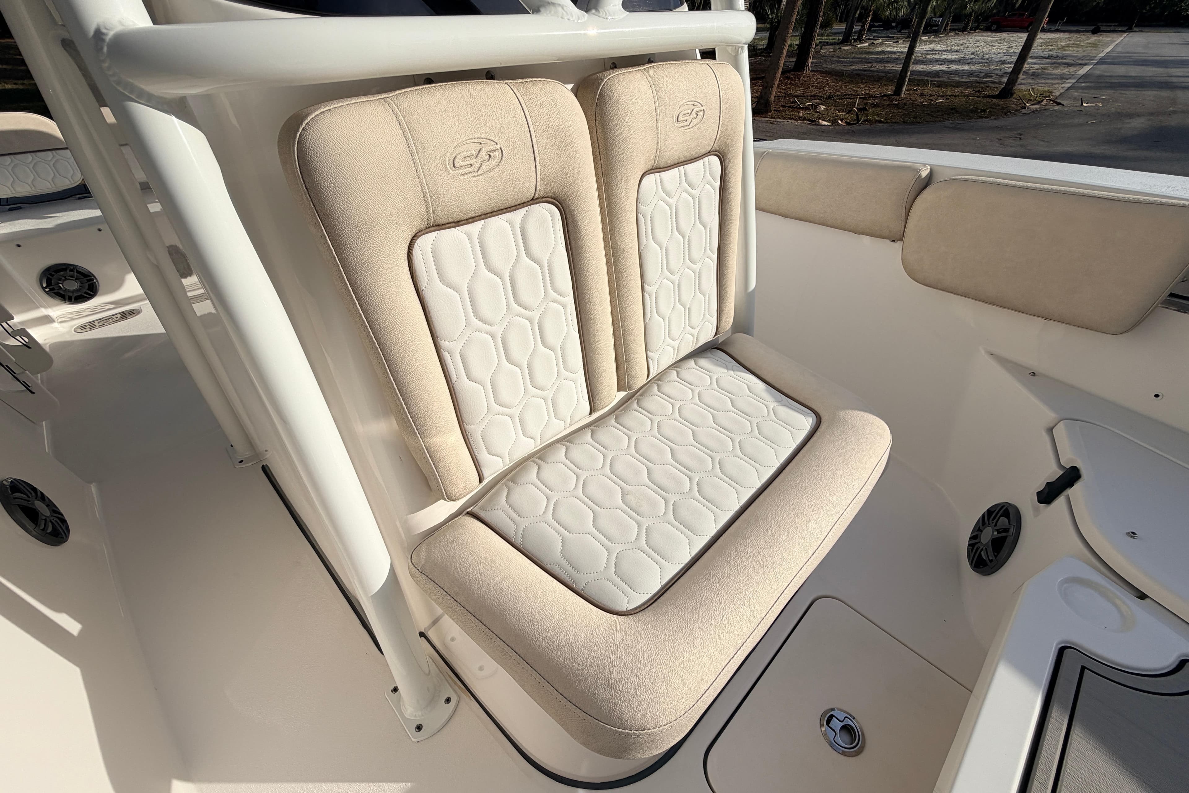 2022 Sea Fox 228 Commander boat seat with beige and white upholstery.
