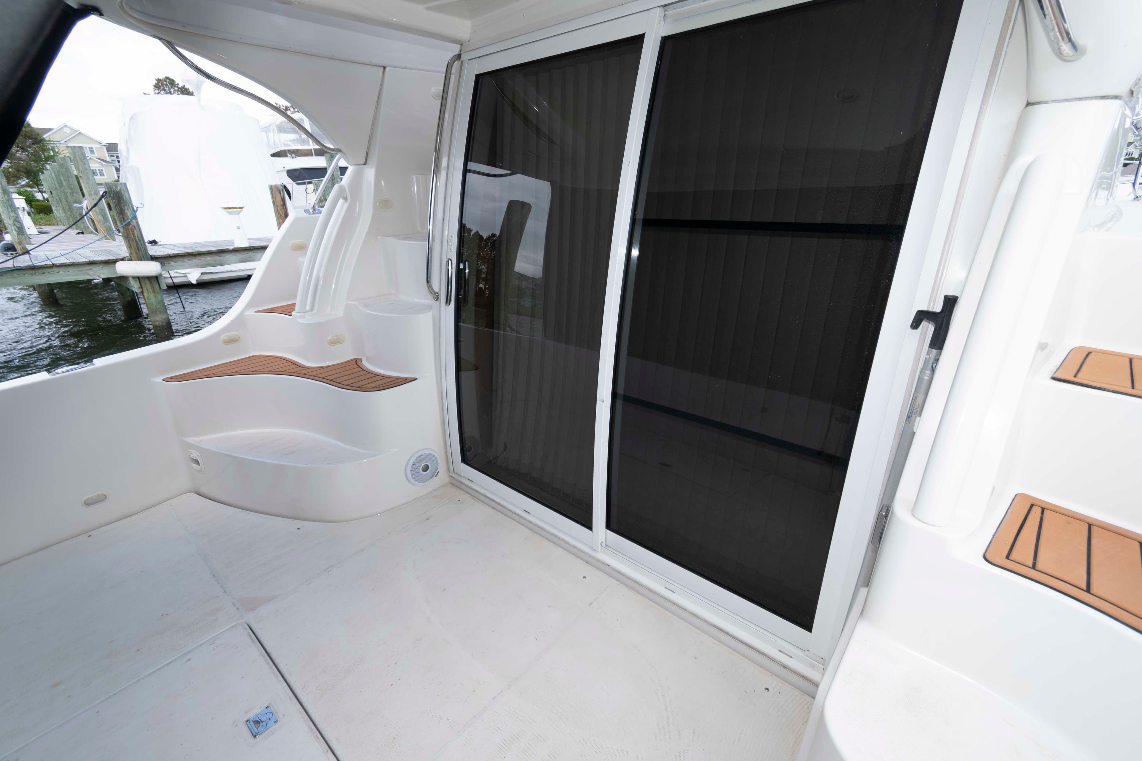 2005 Carver 360 Sport Sedan yacht interior with sliding glass doors and sleek design.
