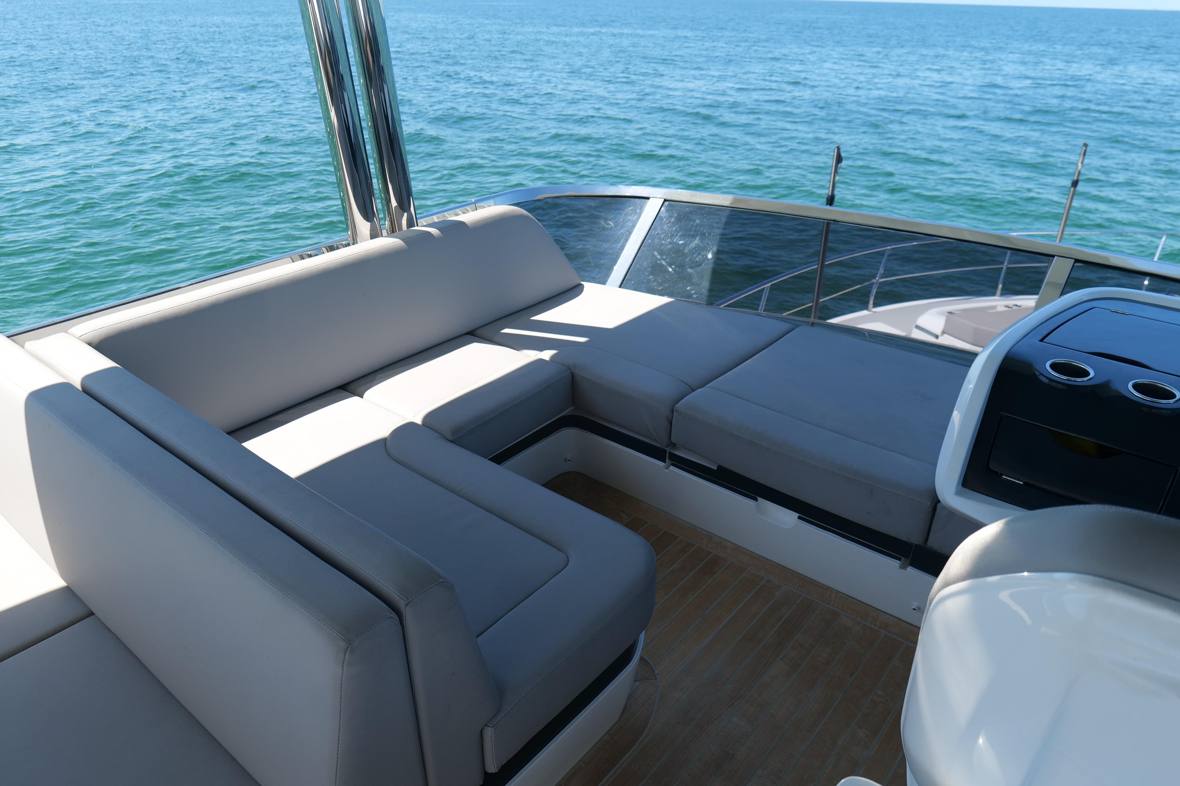 Luxurious seating area on 2022 Pearl 62 yacht with ocean view.