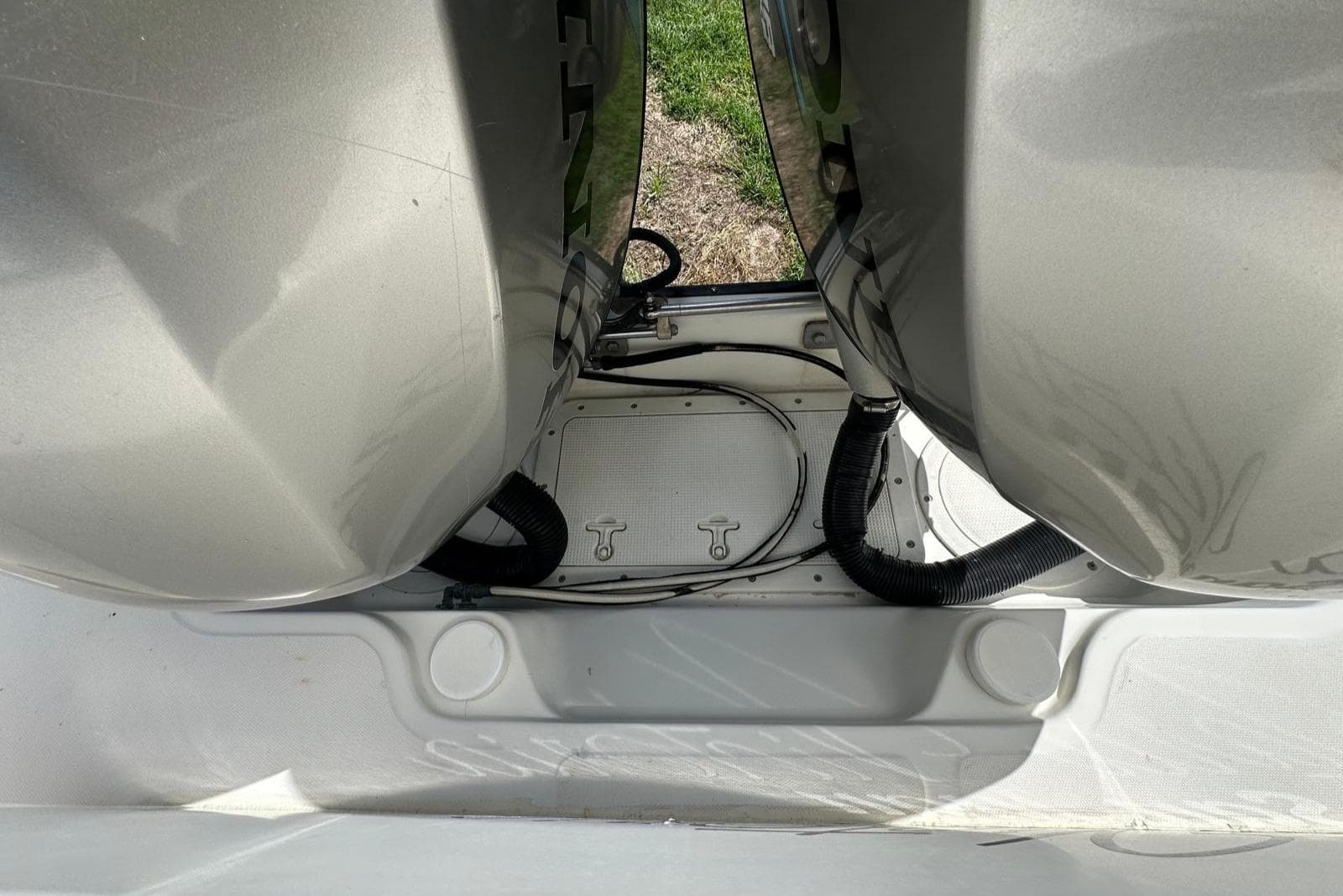 1998 Boston Whaler 23 Conquest boat engines, viewed from above, showing dual outboard motors.