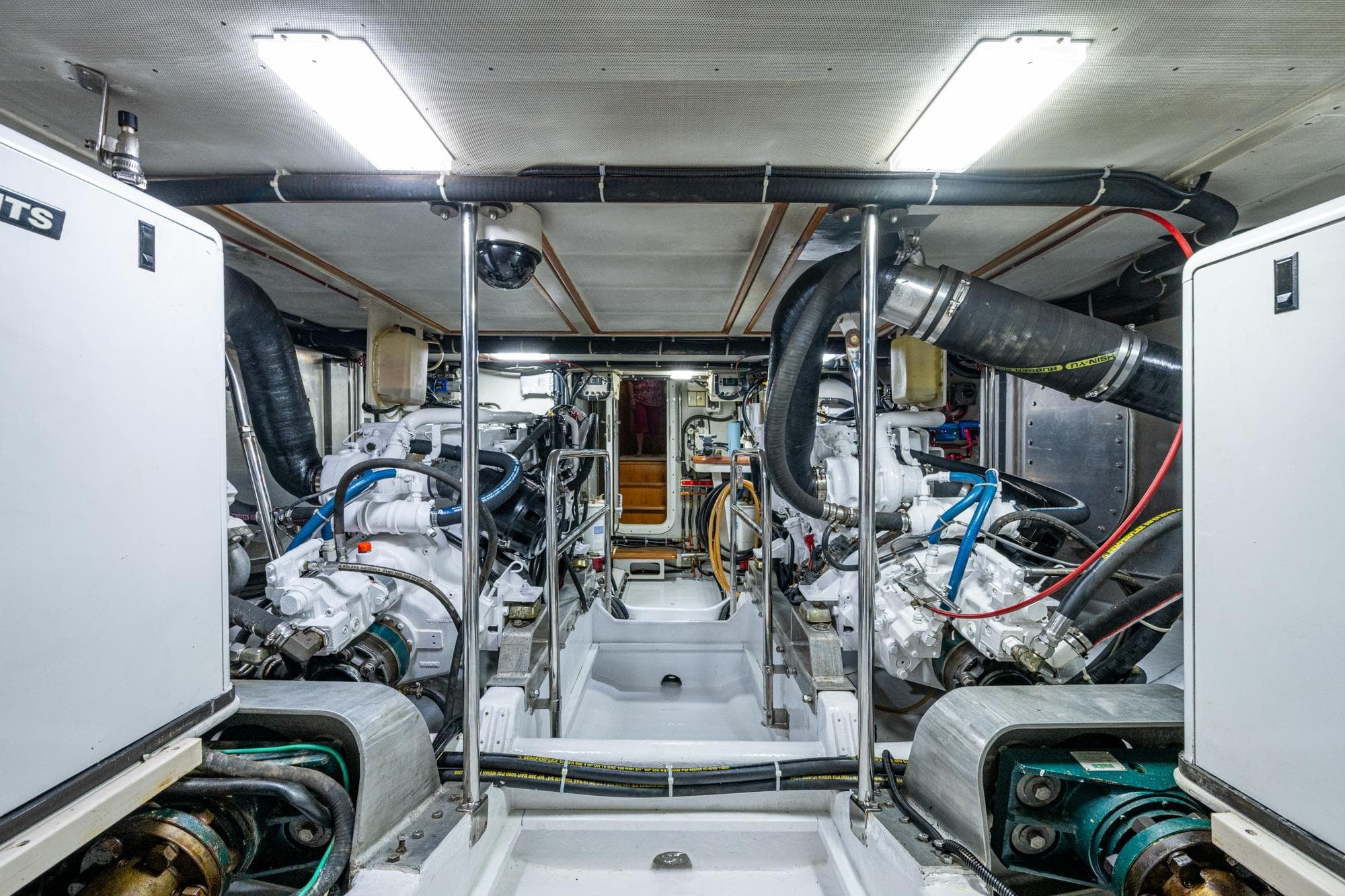 Engine room of a 2006 Krogen 58 yacht, showcasing dual engines and mechanical systems.