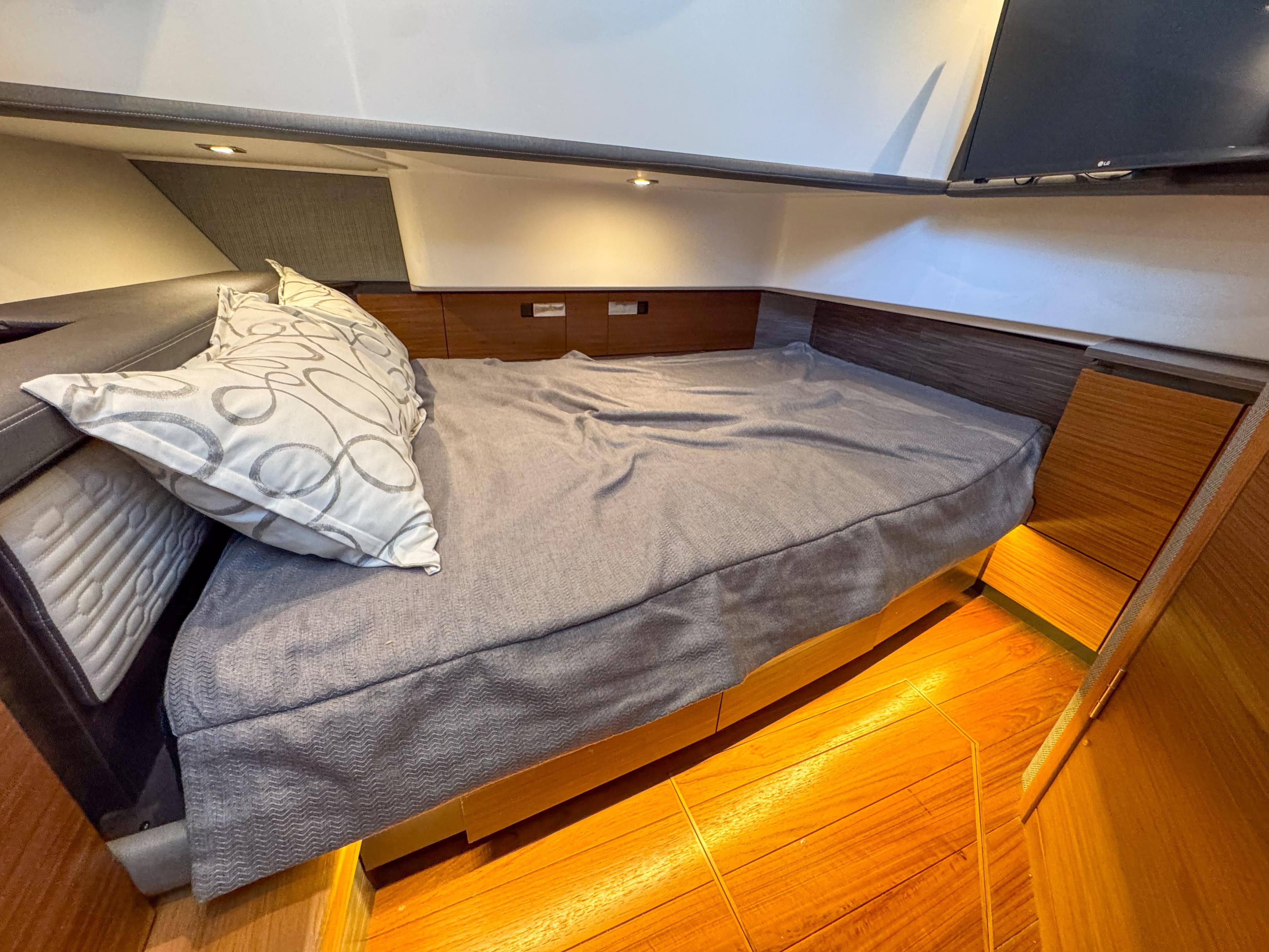 2020 Tiara Sport 38 LS cabin interior with cozy bed and modern design.
