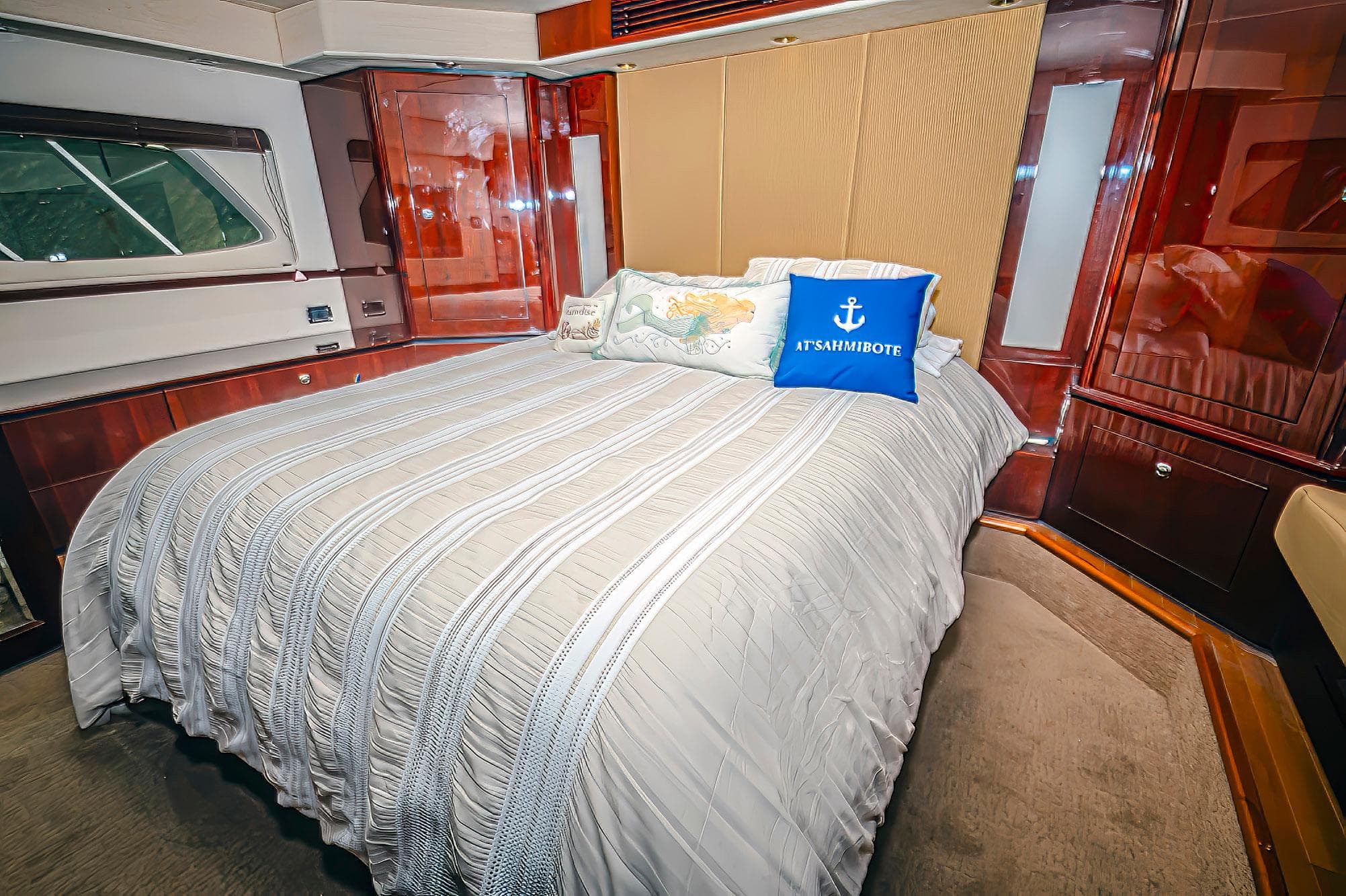 Luxurious bedroom interior of 2011 Sea Ray 580 Sundancer yacht with elegant bedding.