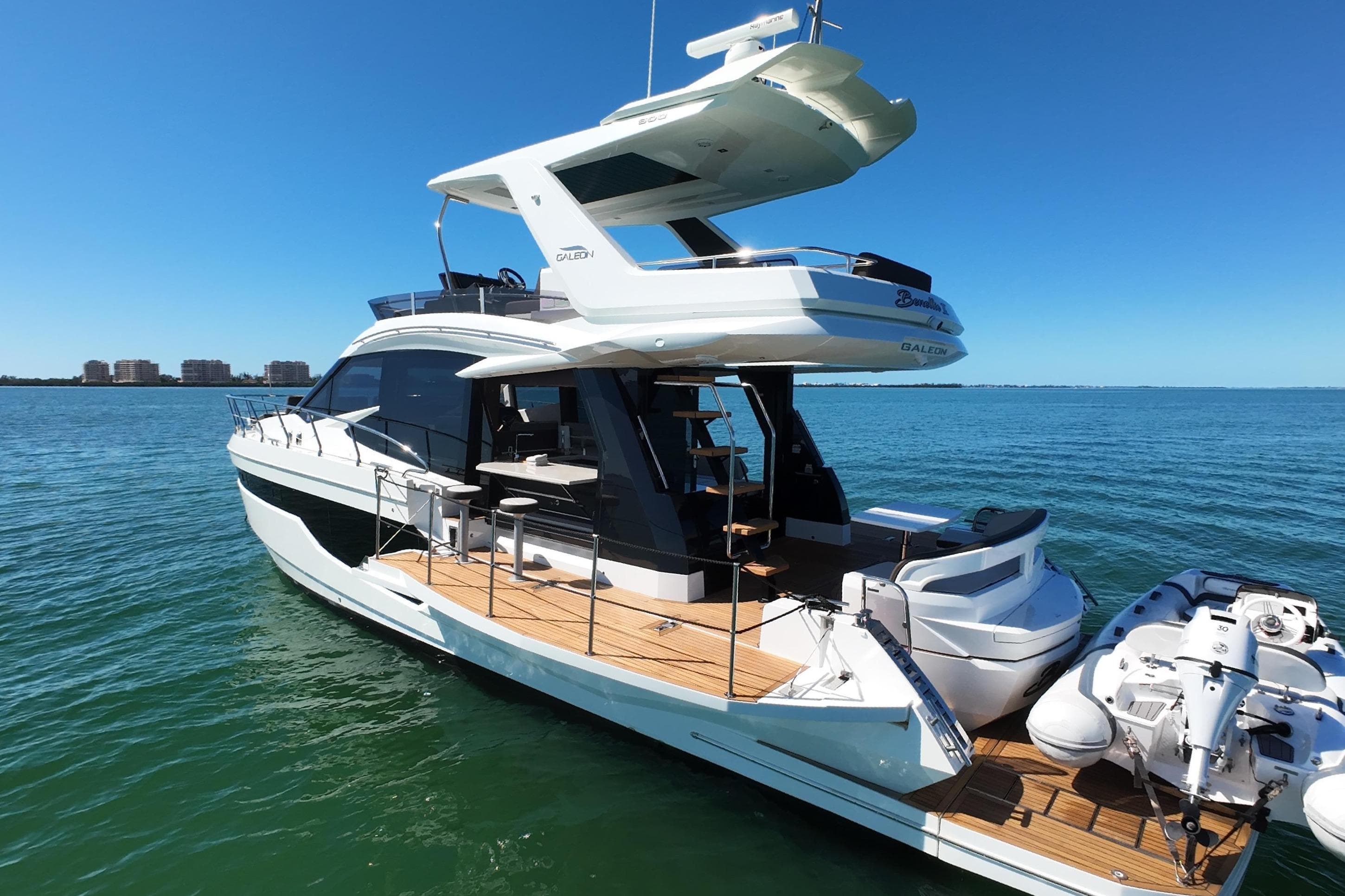 2022 Galeon 500 Fly yacht on calm blue water, showcasing sleek design and luxury features.