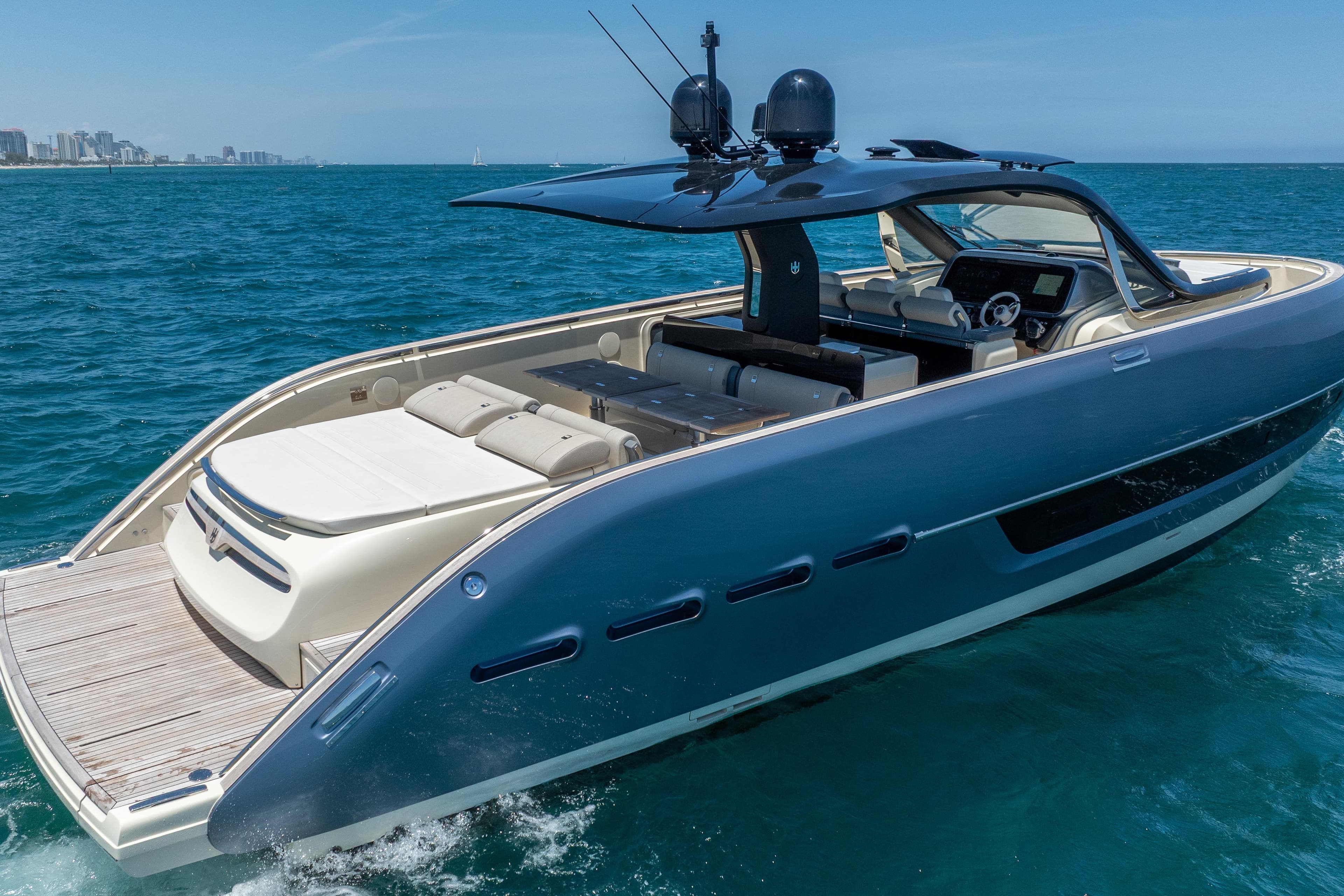 2024 Invictus 460 yacht cruising on blue ocean waters, showcasing sleek design and luxury features.