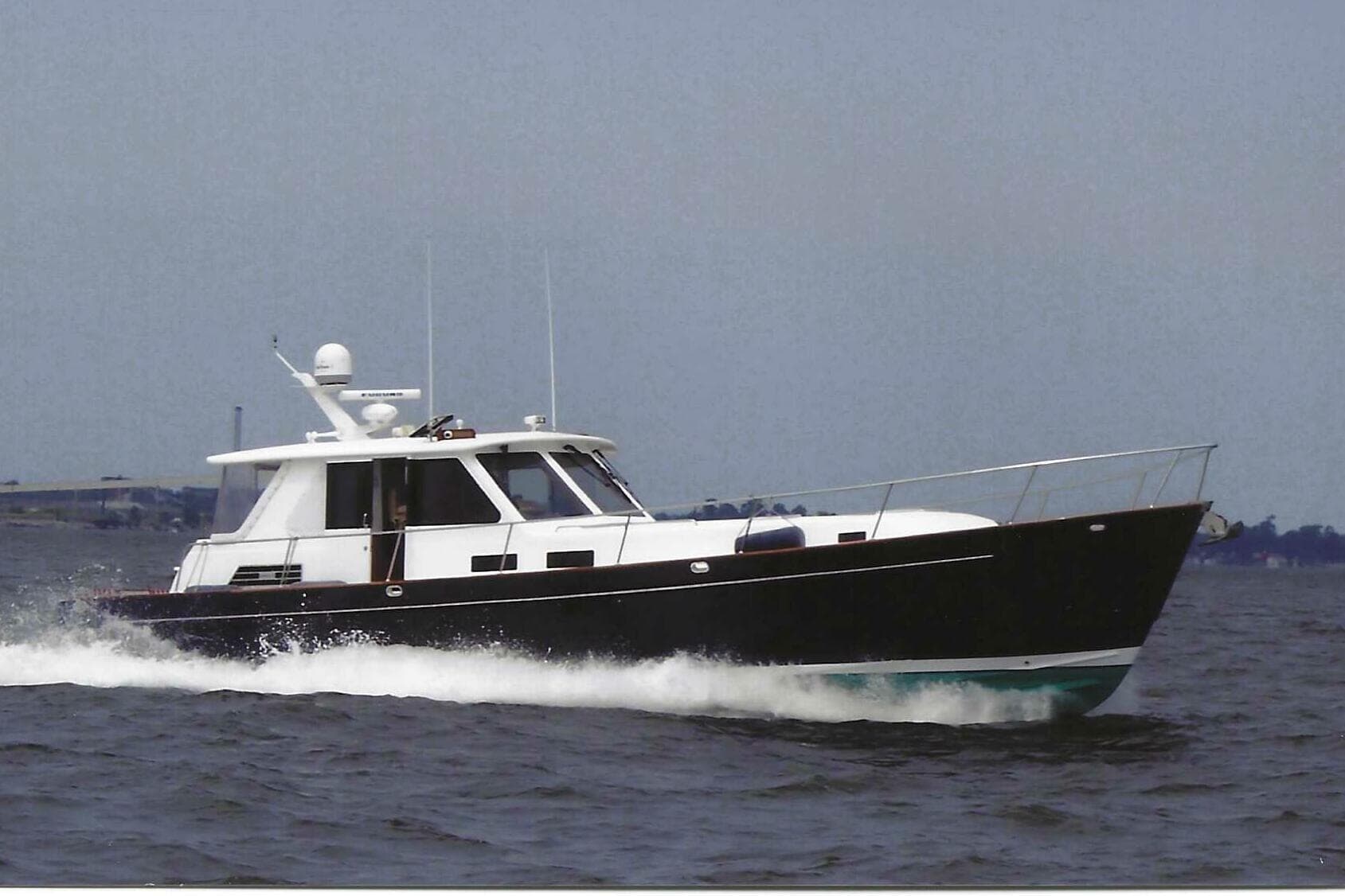 2002 Legacy Yachts 52 Express cruising on open water.