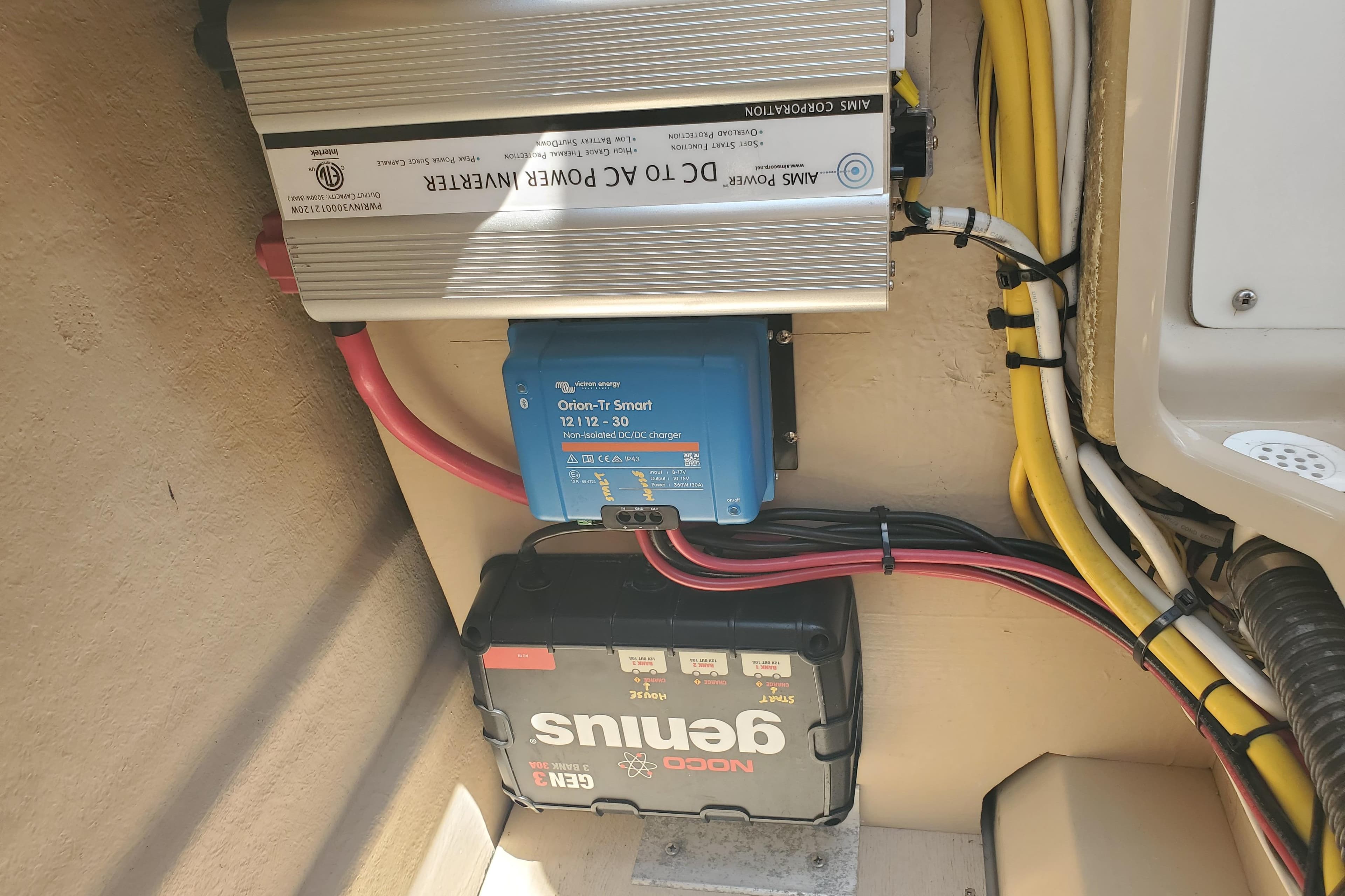 Electrical setup in a 2013 Cutwater 26 boat, featuring inverter and battery charger.