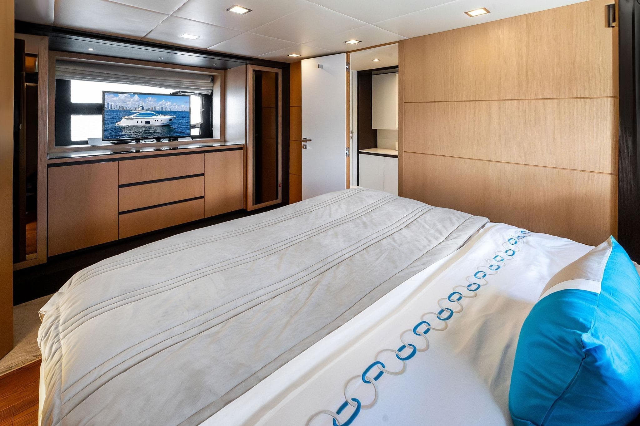 Luxurious bedroom interior on a 2013 Absolute 64 yacht, featuring modern design and elegant decor.